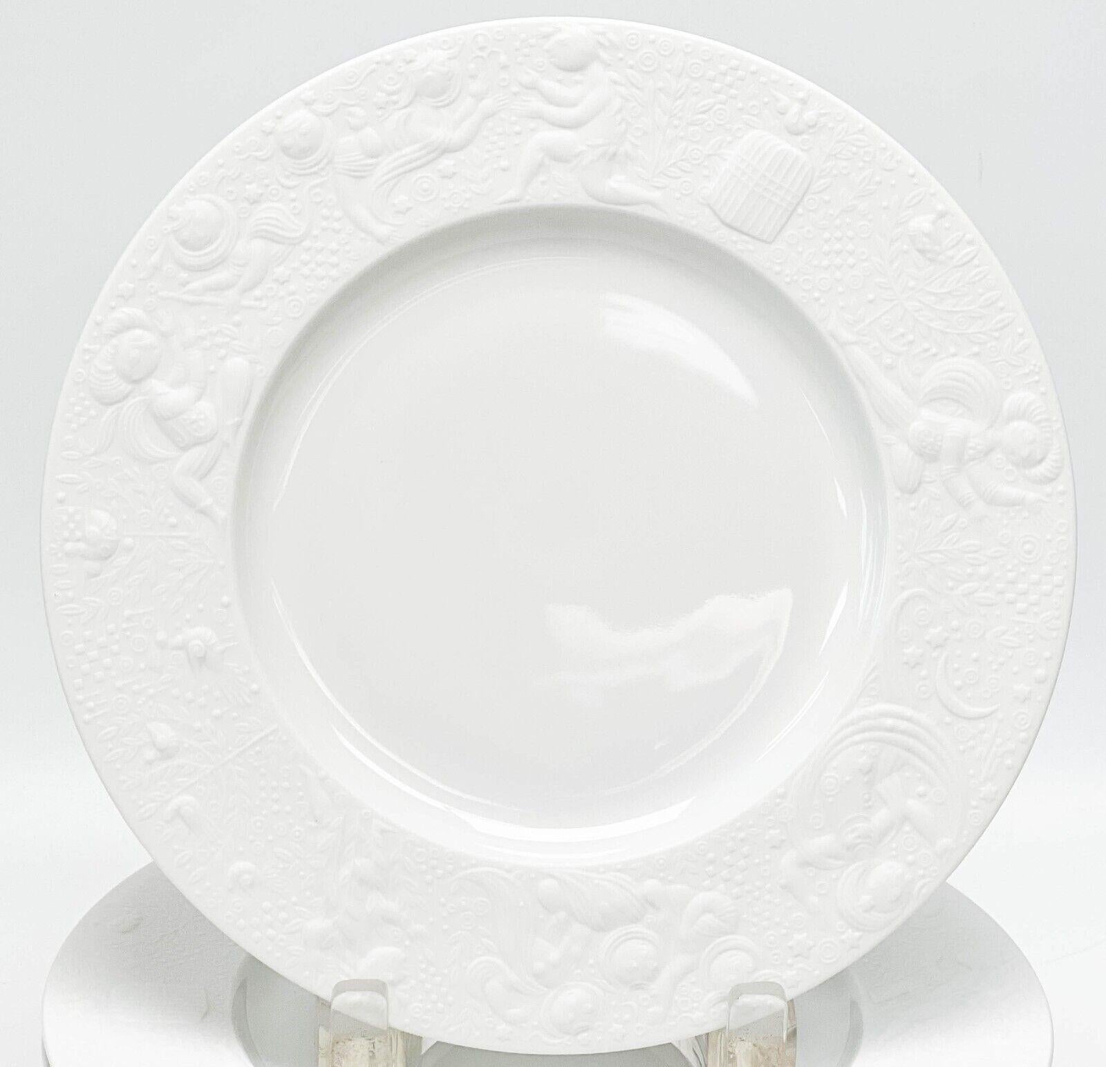 Set of 12 Rosenthal Germany Porcelain Salad Plates in Magic Flute White

White porcelain with embossed figures around the rim with a matte finish. Underside marked Rosenthal Germany, Bijorn Wiinblad and with various gold lettering to the underside