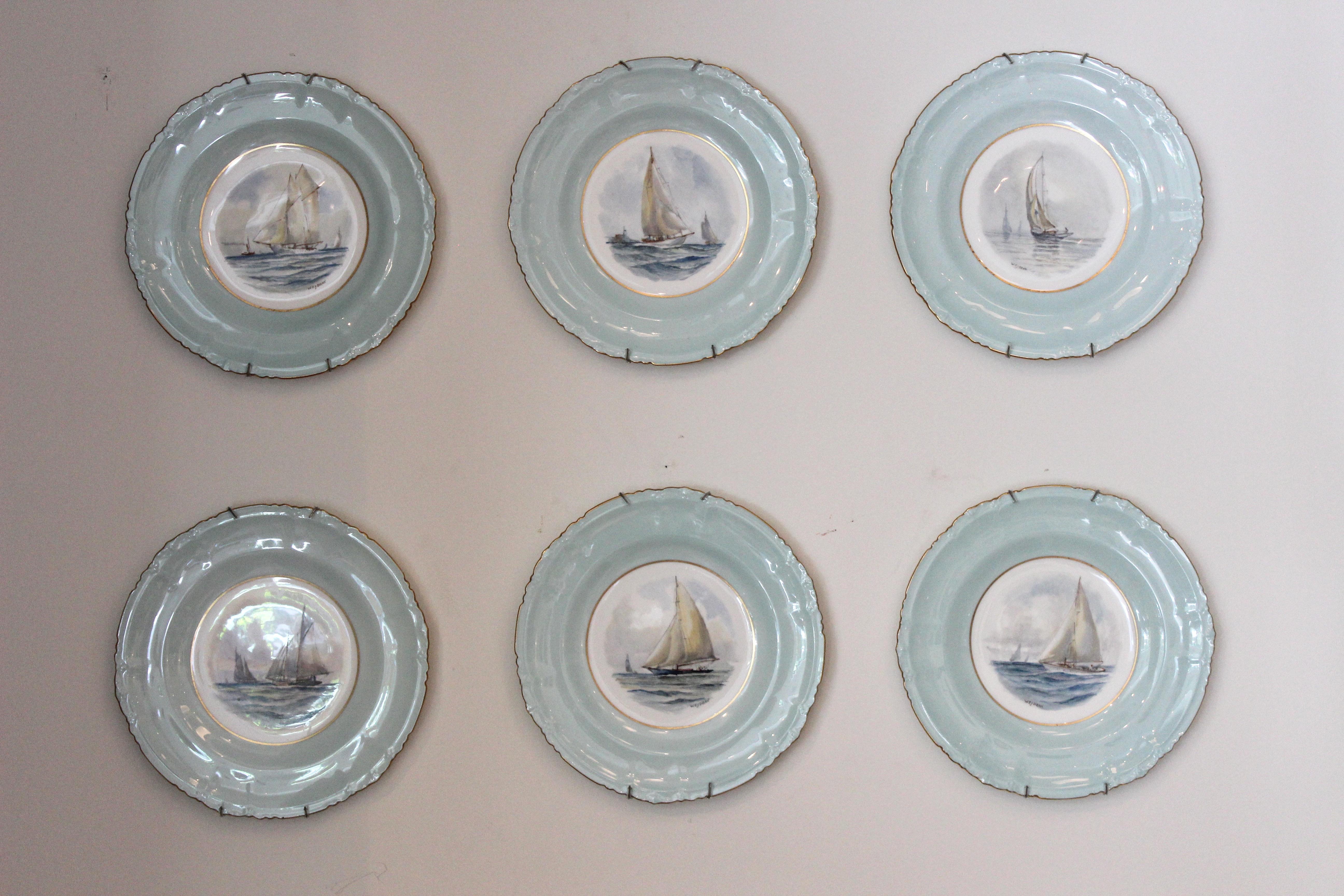 Set of 12 Royal crown derby porcelain plates with hand-painted yachting scenes... each plate is stamped and identified on the reverse. Signed Wej Dean.