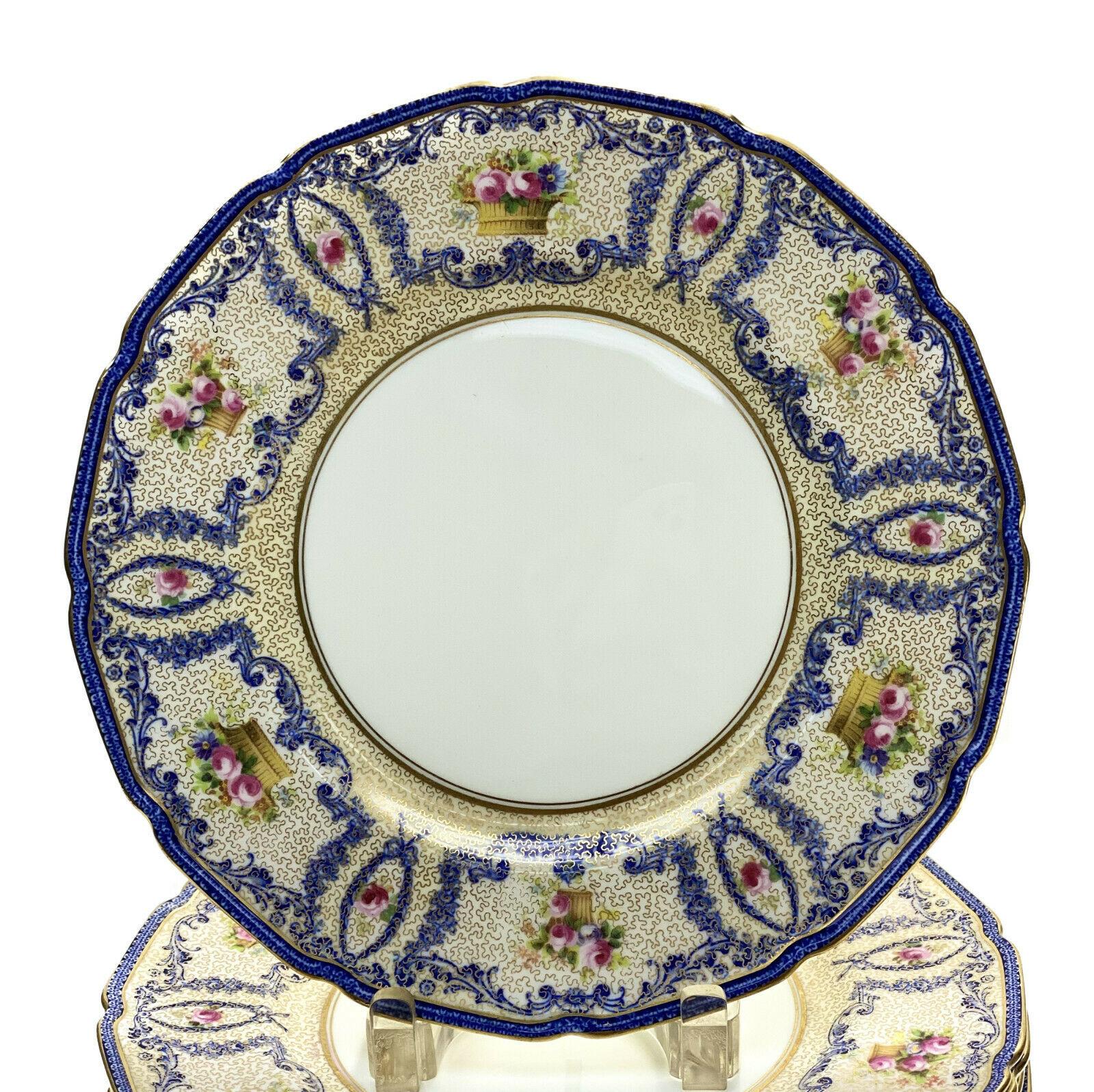 Set of 12 Royal Doulton England Porcelain Dinner Plates, circa 1925.

Additional Information:
Material: Porcelain. 
Featured Refinements: Royal Doulton Plate.
Year Manufactured: 1925.
Brand: Royal Doulton.
Type: Dinner Plate.
Dimension: