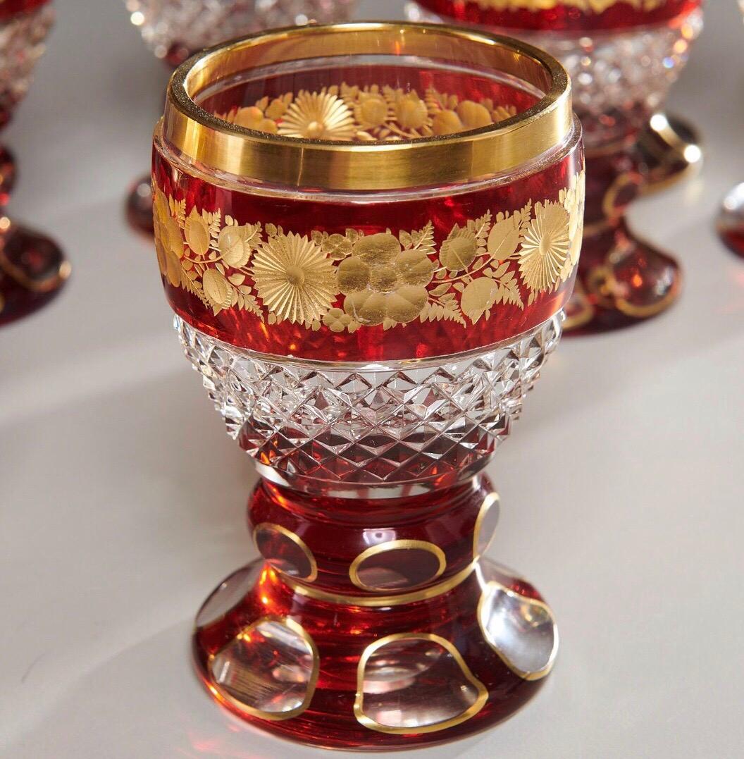 Cut clear and ruby glass, with gilt floral banding.