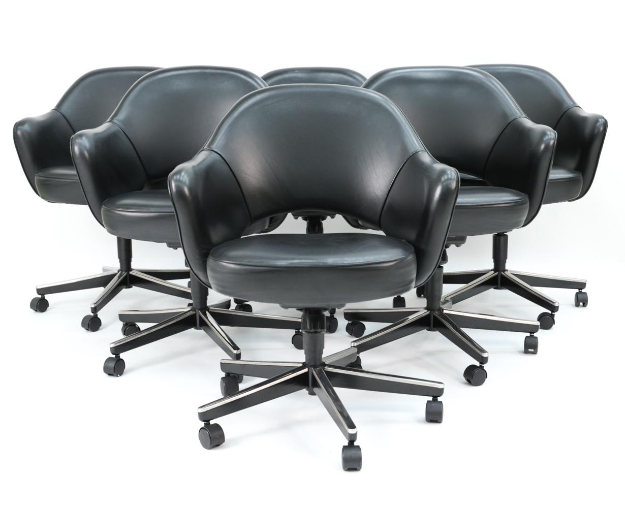 Set of (12) contemporary Eero Saarinen executive armchairs, with rolling swivel bases and black Volo leather upholstery, circa 2004.
Featured in nearly all Florence Knoll-designed interiors, the Saarinen executive chair has remained one of Knoll's