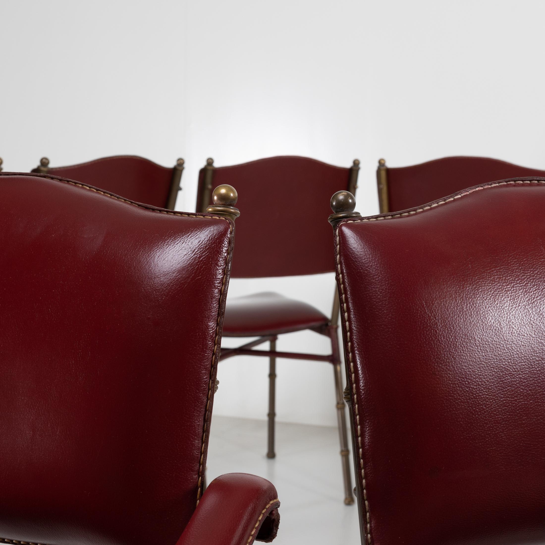 20th Century Set of 12 Saddle Stitched Red Leather Chairs by Jacques Adnet, France For Sale
