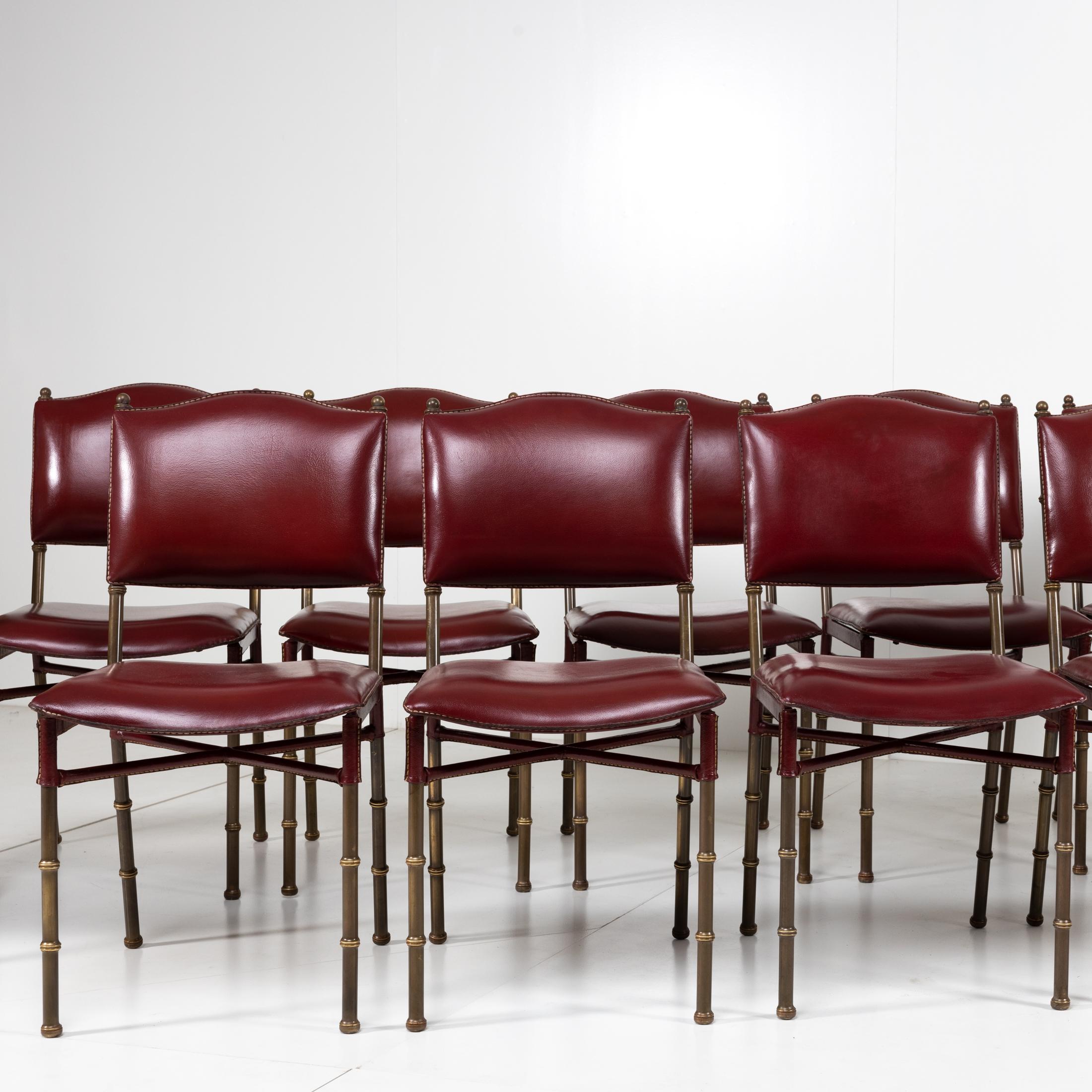 Brass Set of 12 Saddle Stitched Red Leather Chairs by Jacques Adnet, France For Sale