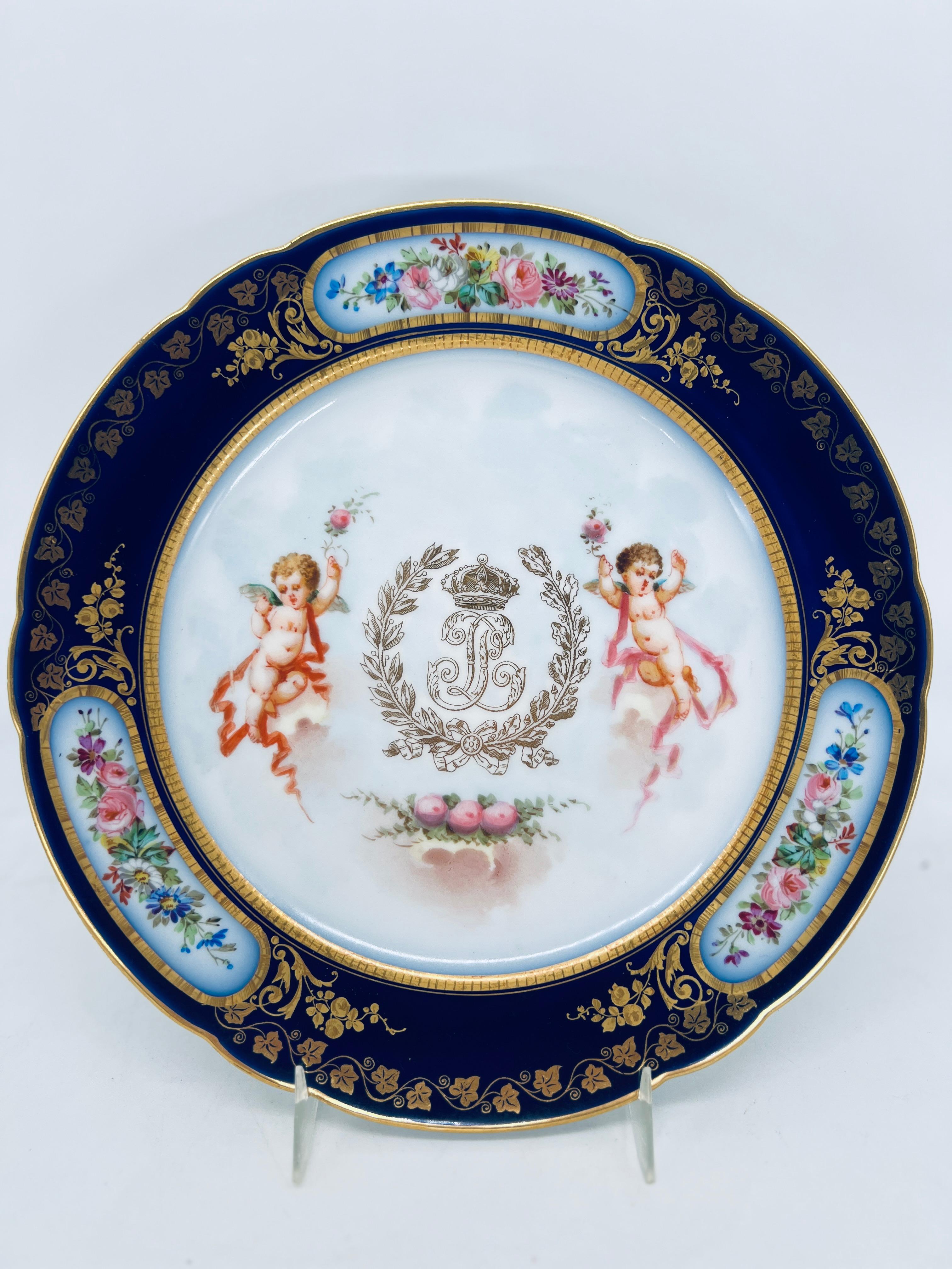 Sevres, Set of 12 Circa 1846. Made for the Chateau Des Tuileries service of Louis Phillippe. 

This exquisite 19th-century porcelain plate set, crafted by the renowned Sèvres manufactory, features an opulent design associated with the Château des