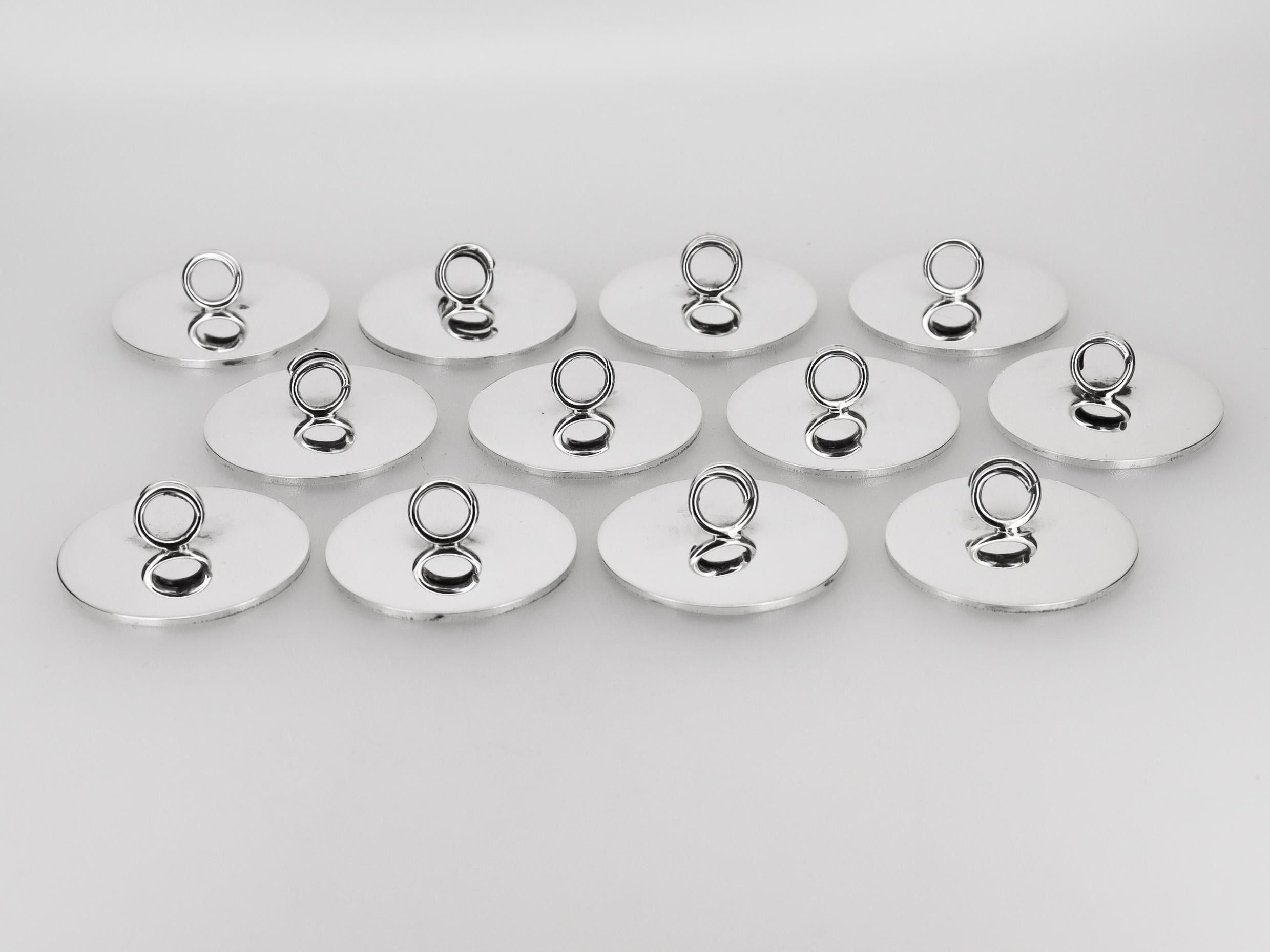 Juego de 12 portavasos de plata de ley firmados por Cartier, modernos de mediados de siglo Desconocido en venta