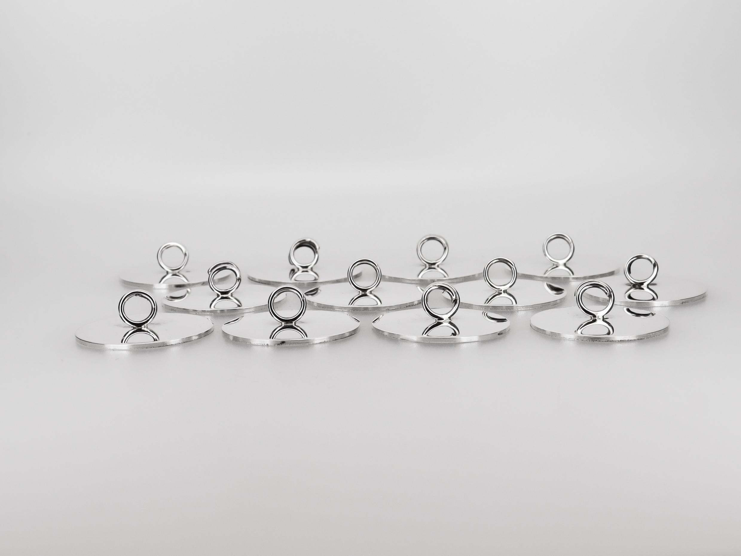 Juego de 12 portavasos de plata de ley firmados por Cartier, modernos de mediados de siglo Plata esterlina en venta