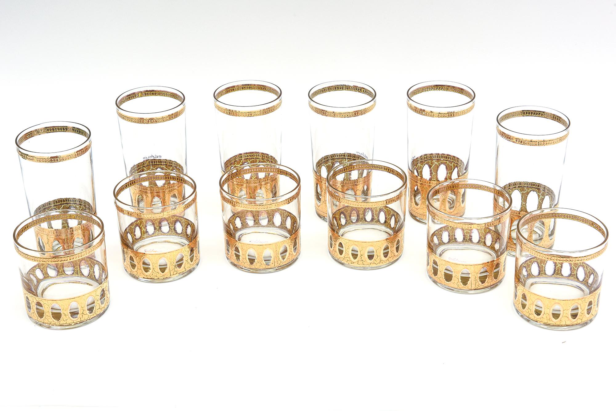 This set of signed 22 Karat gold plated Culver Mid-Century Modern barware set consists of 6 highballs and 6 low ball drinking glasses. It is from the 50's and is adorned with a gold plated design. These must be hand washed only with a mild detergent