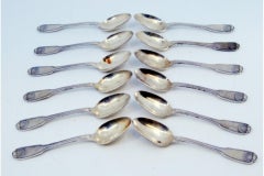 Set of 12 silver coffee spoons with shell-shaped relief handles