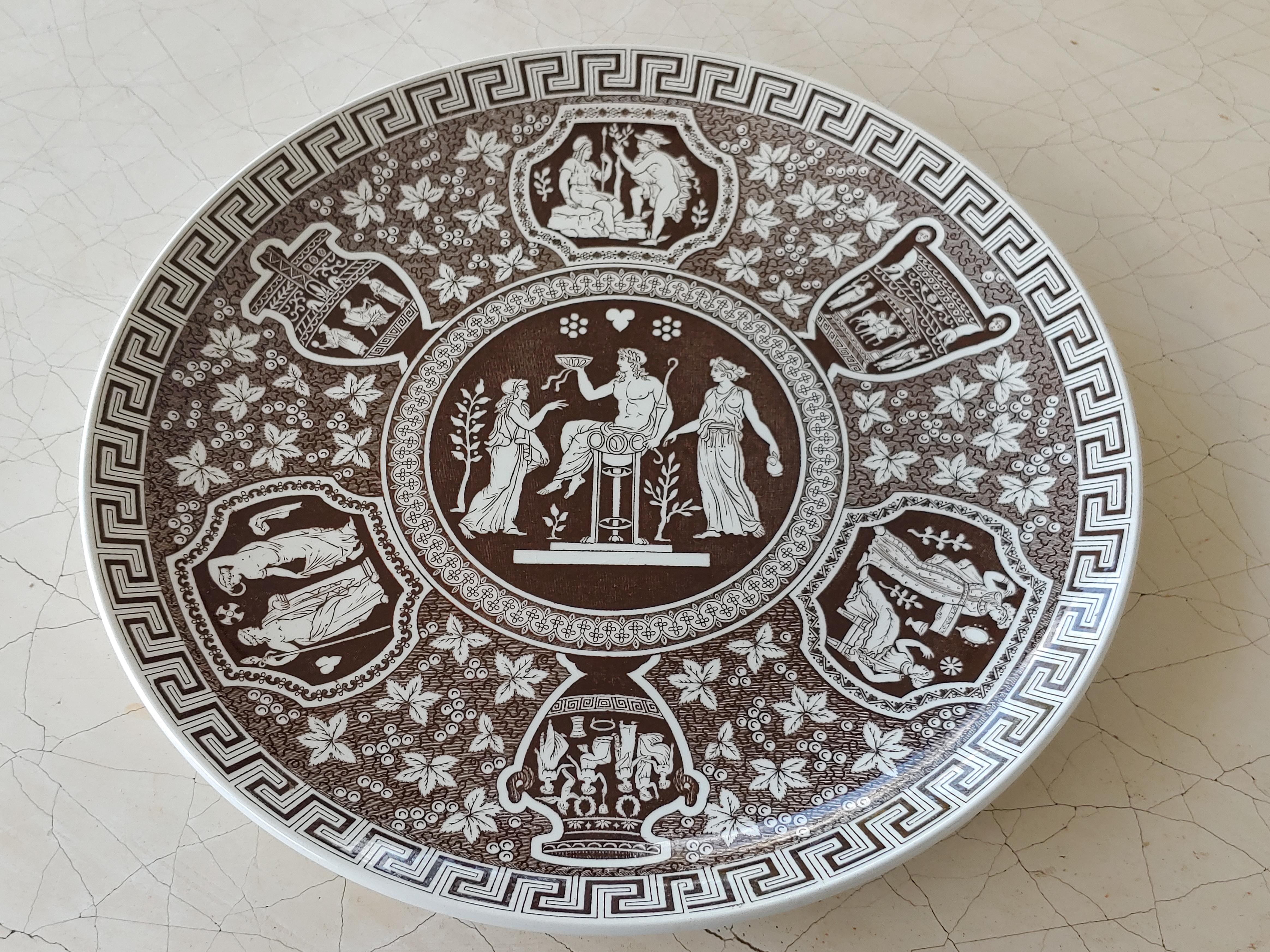 Set of 12 English Copeland Spode plates in brown Greek pattern, depicting Classical scenes with greek-key edging and floral background. 

Letter 