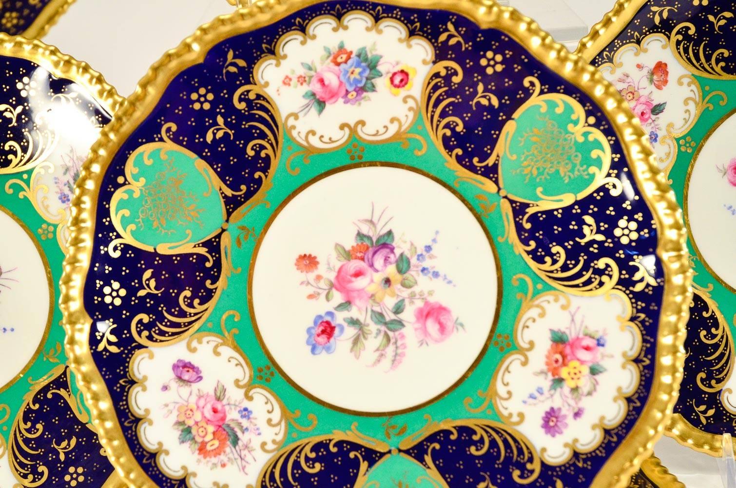 This set of 12 Spode Copelands, Sevres style dessert plates combine all the best features of both design and practicality. The combination of Classic Sevres green with cobalt blue, hand-painted floral reserves and gilded highlights, creates a