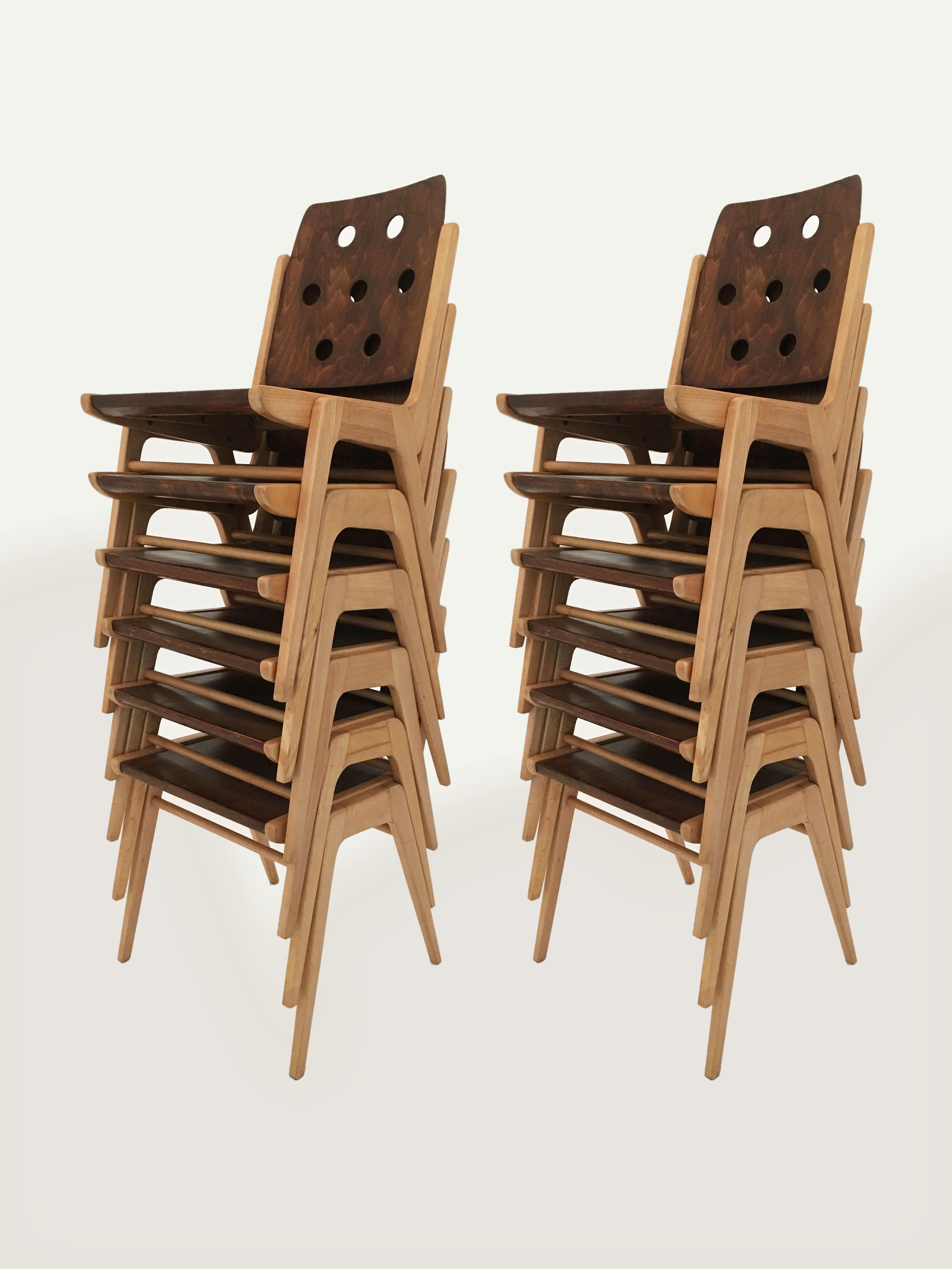 Delightful set of twelve (12) duo-colored stacking dining chairs designed by Austrian architect Franz Schuster, Austria, 1950s. On first sight the design appears to be similar to the famous Roland Rainer Stadthallen chair, although it is quite