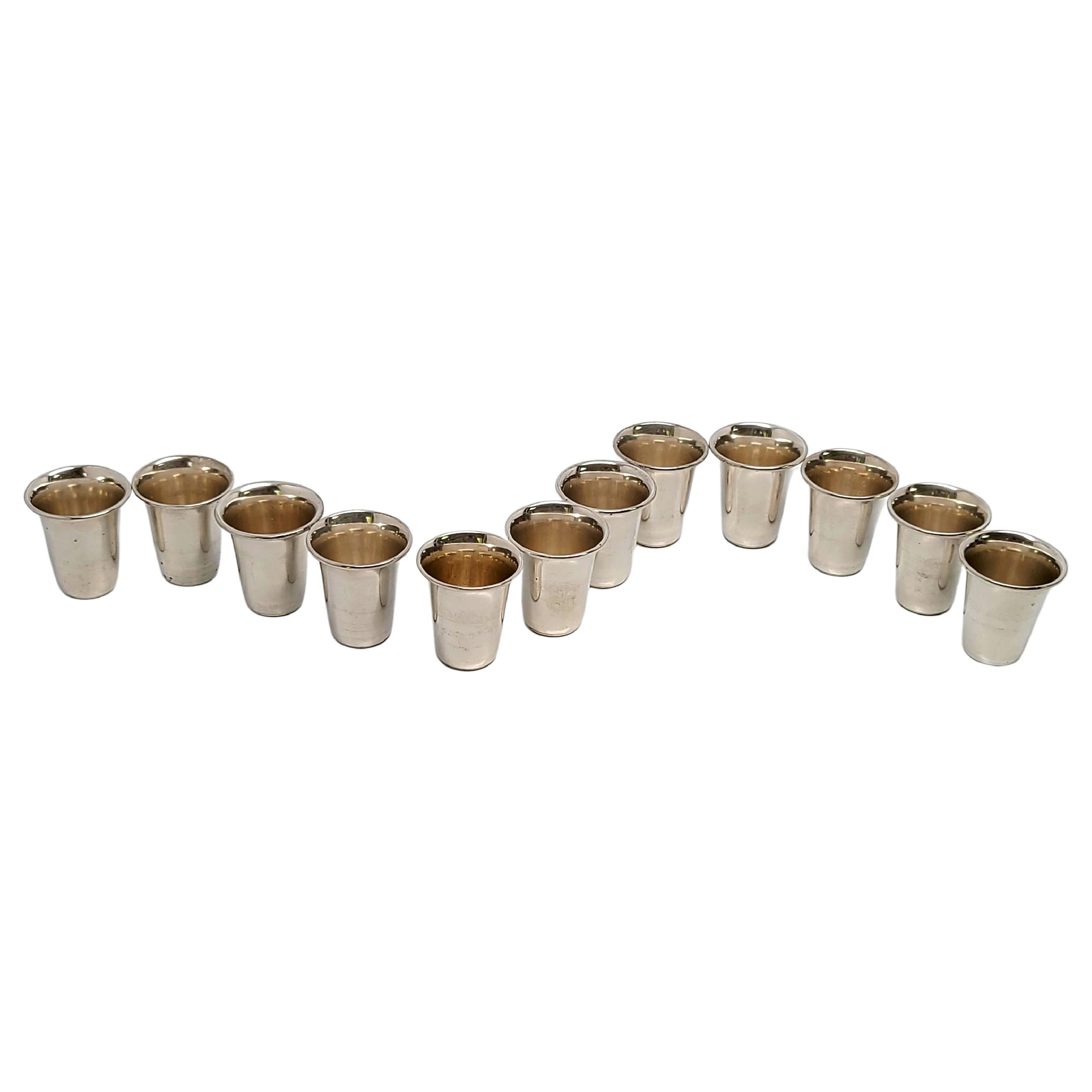 Set of 12 vintage sterling silver vodka or kiddush cup.

Beautifully simple and timeless, these cups feature a polished finish with a rolled lip.

Each cup measures 1 5/8