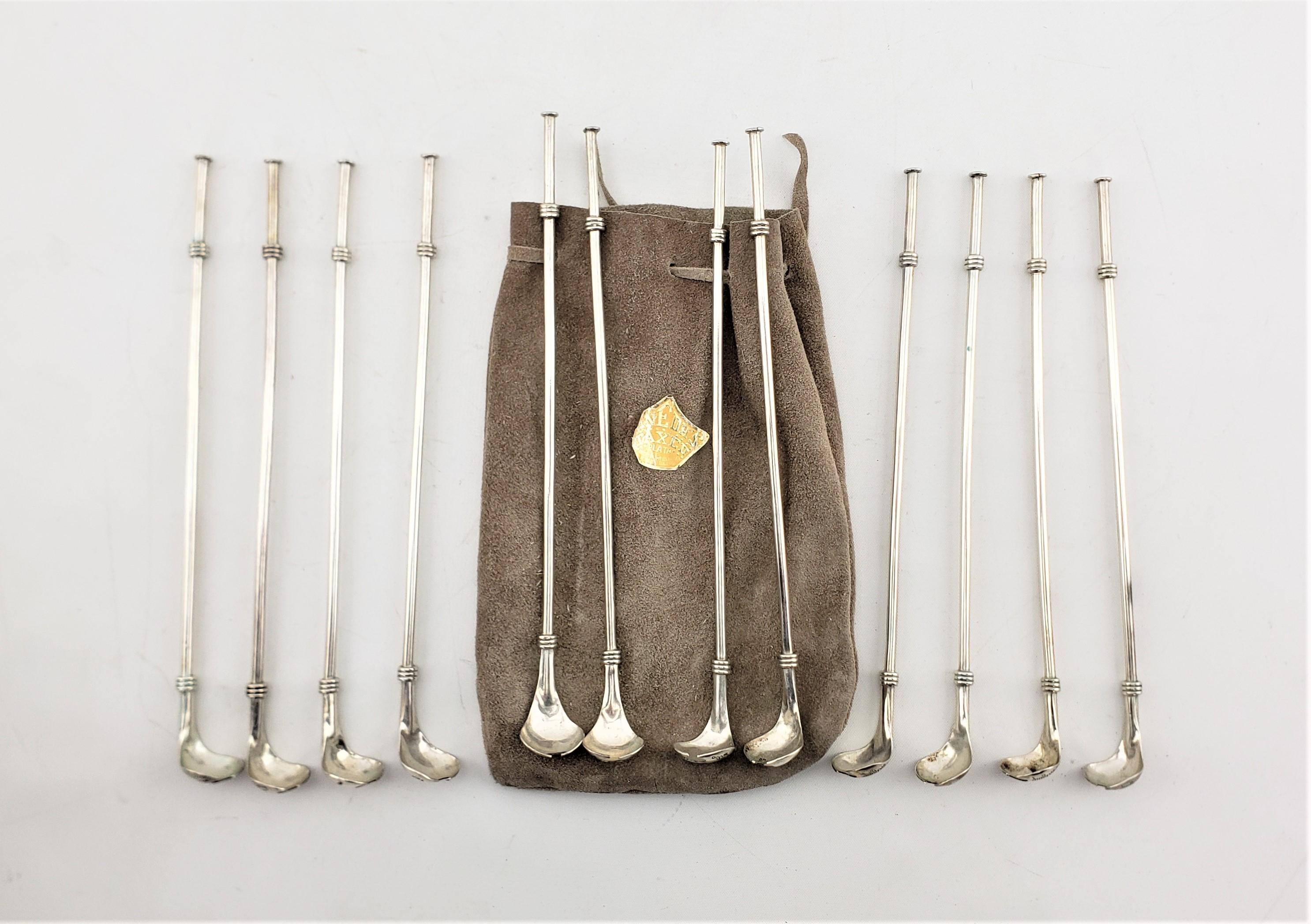 This set of twelve sterling silver cocktail spoons were made by the renowned Taxco of Mexico in approximately 1960 in the period Mid-Century Modern style. The spoons stand approximately eight and a half inches high with a hollow tubed handle that