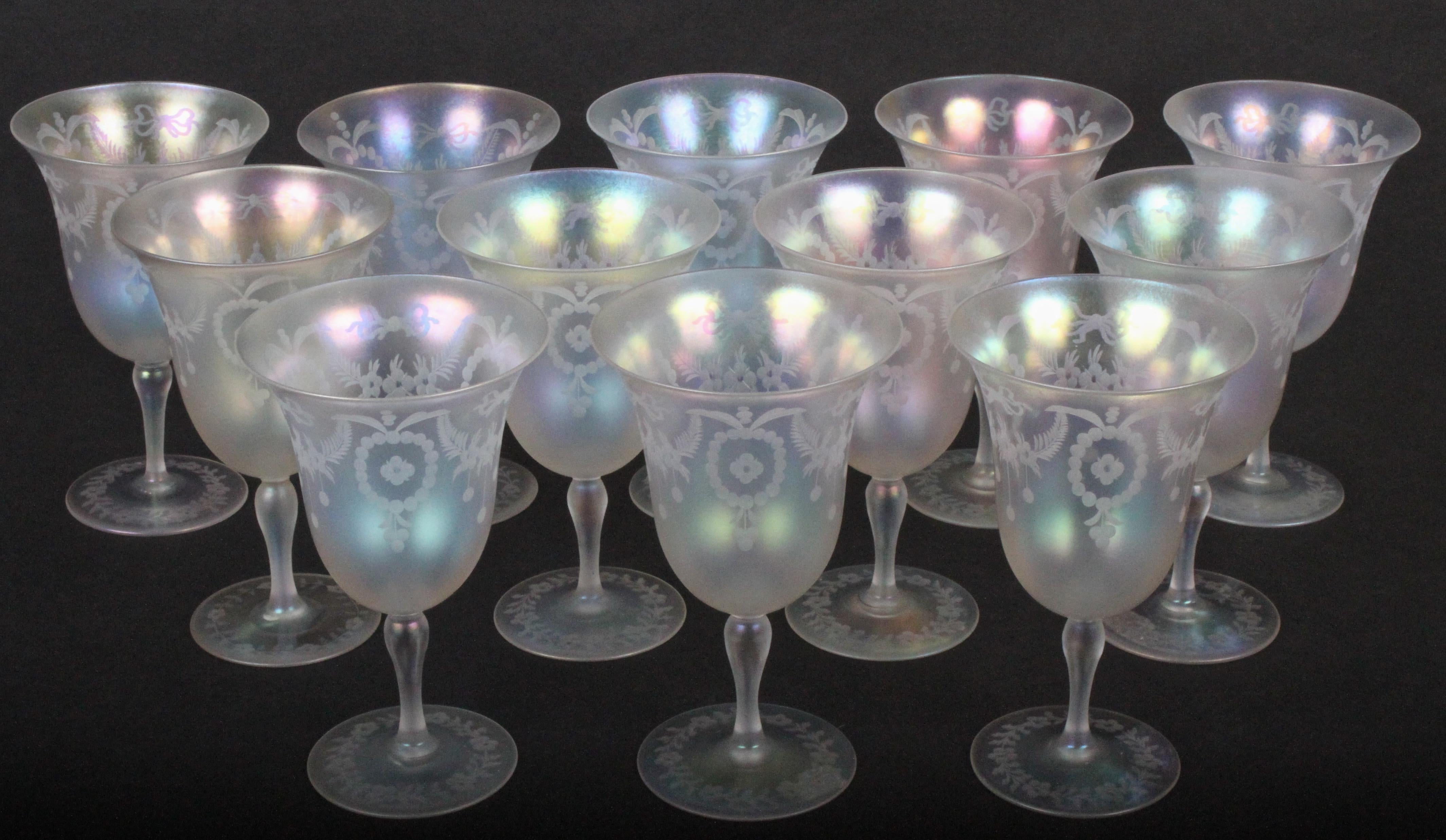 This set of 12 Steuben verre de soie goblets and water pitcher is both beautiful and exceedingly rare. The set features 12 goblets and a pitcher, all etched by the T.J Hawkes Company in the Adam style pattern known as 