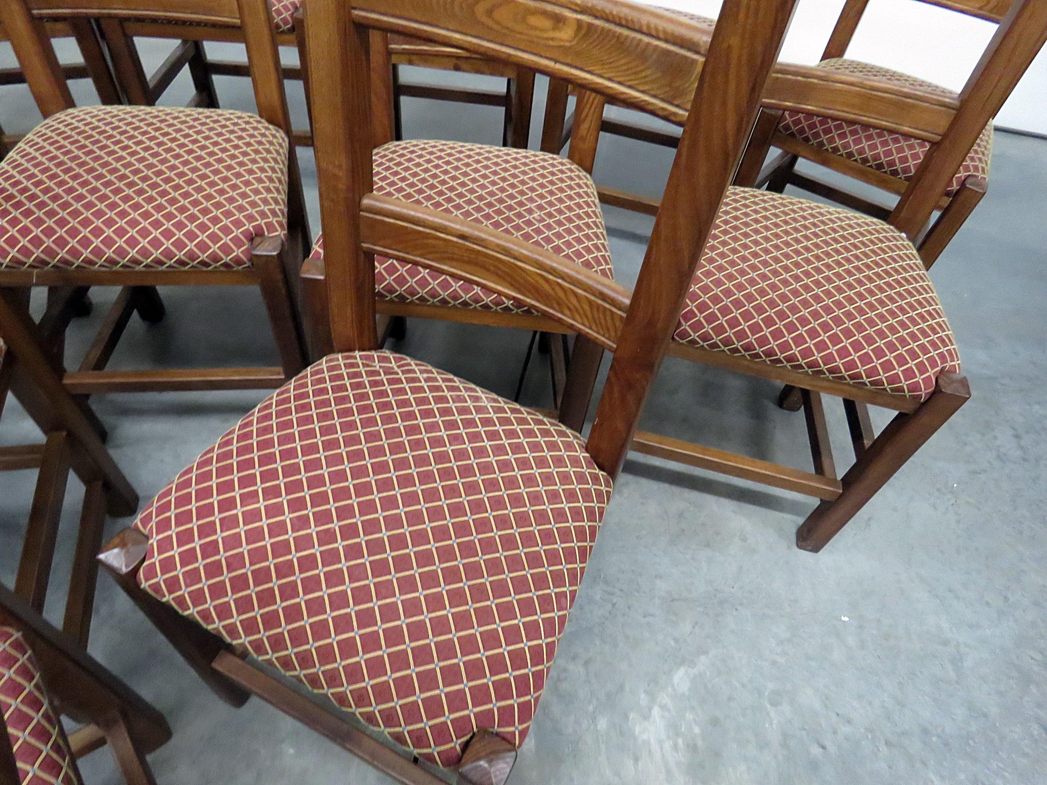 Set of 12 Stickley style dining room side chairs with upholstered seats.