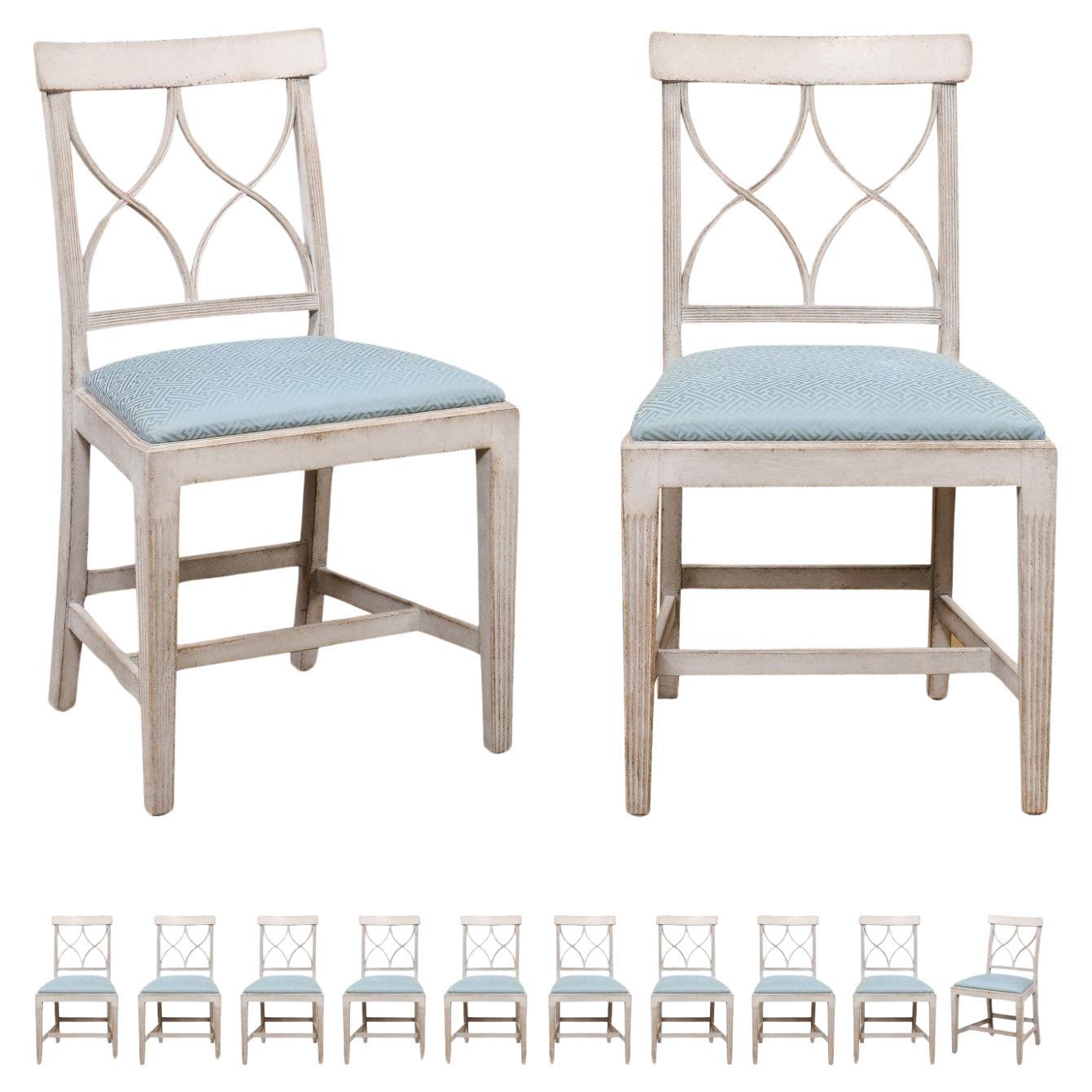 Set of 12 Swedish 1900s Painted Dining Room Chairs with Sinuous Pierced Motifs For Sale