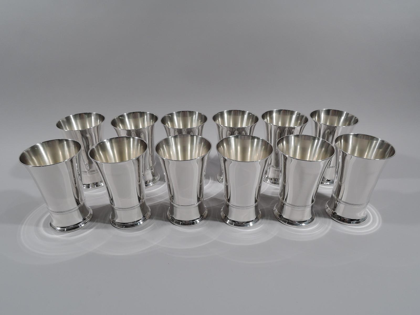 Set of 12 Art Deco sterling silver highballs. Made by Tiffany & Co. in New York, circa 1915. Each: Girdled cylinder with flared rim and spread foot. Fully marked including pattern no. 18993 (first produced in 1915), order no. 17427, and director’s