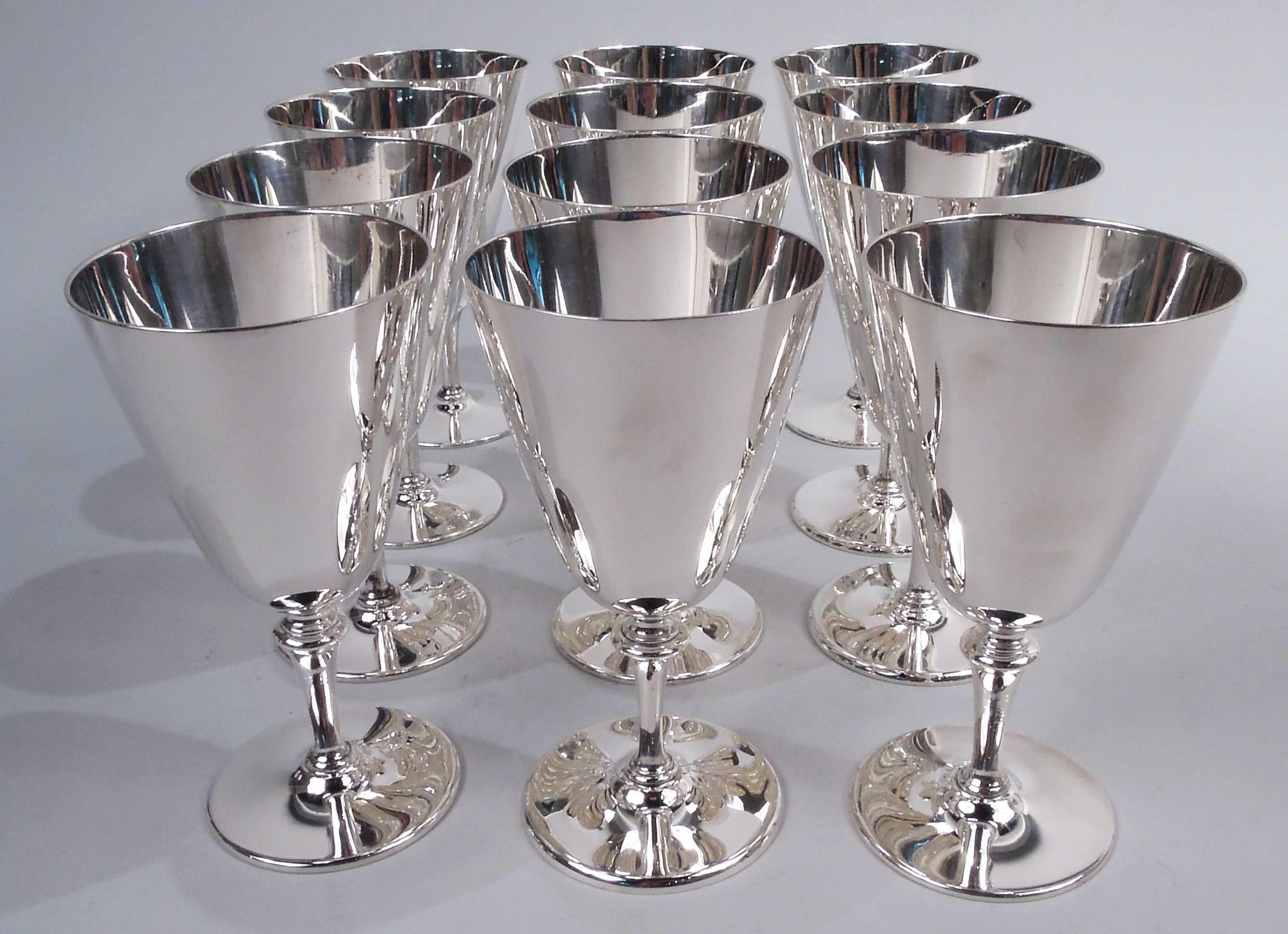 Set of 12 Modern sterling silver goblets. Made by Tiffany & Co. in New York, ca 1940. Each: Conical bowl mounted to tapering stem; foot round and gently raised. Easy grip with nice balance. Fully marked including maker’s stamp and pattern no. 20168.
