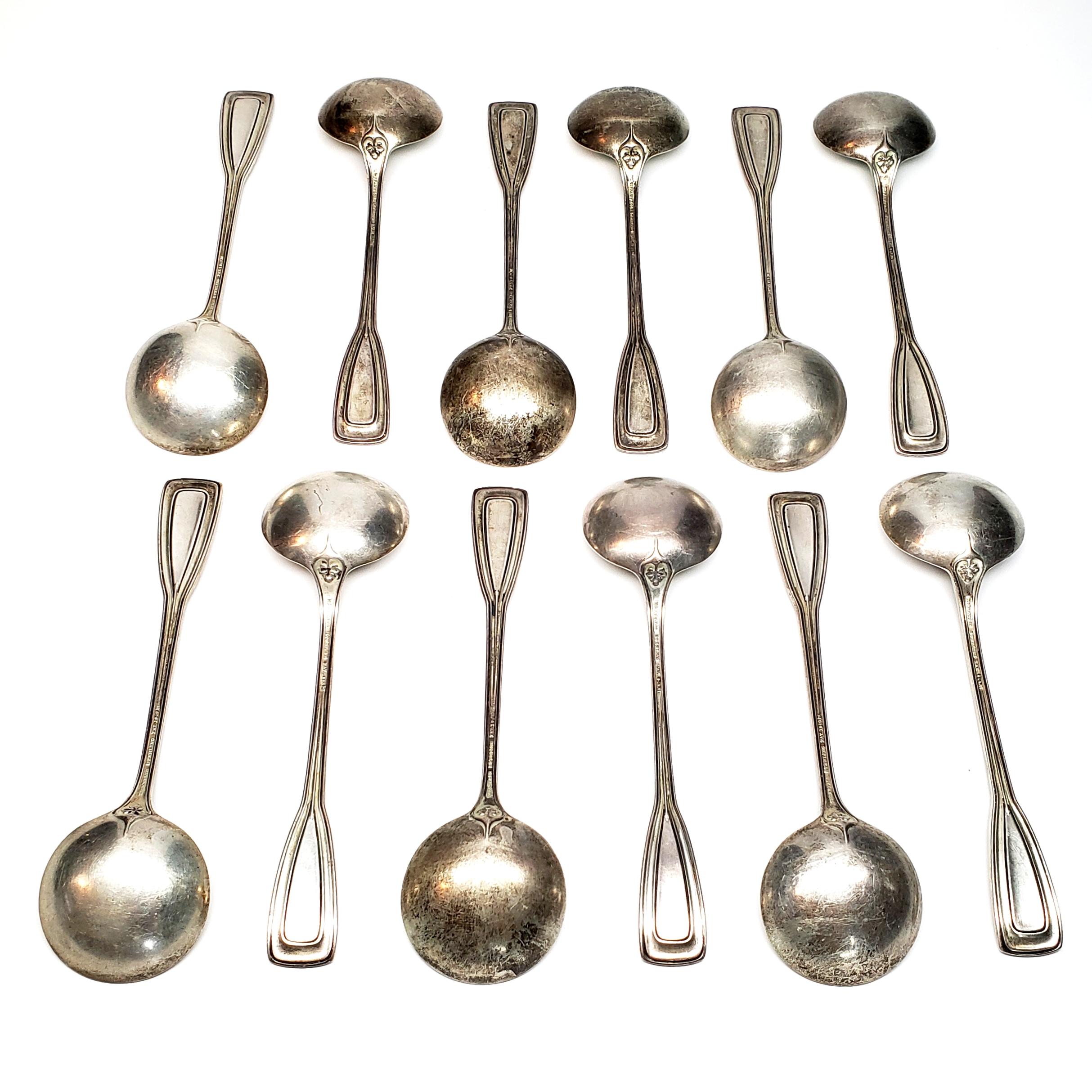 Set of 12 antique sterling silver round bowl bouillon soup spoons by Tiffany & Co in the St. Dunstan pattern, c.1909.

Monogram appears to be M.

Beautiful spoons with a round bowl. The St. Dunstan pattern's oak leaf design is simple in its