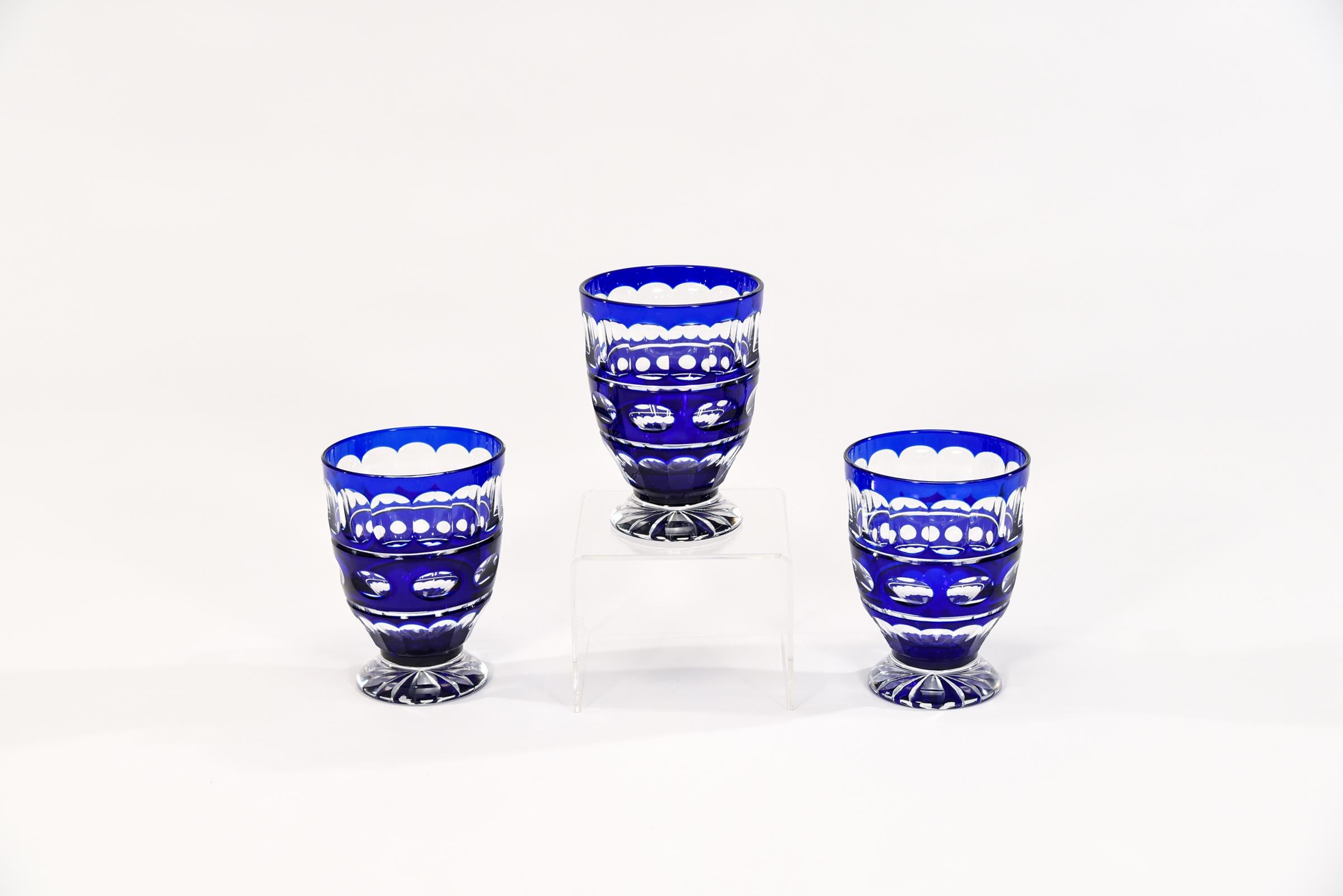 Tumblers are in!! This is a set of 12 large and rare sized hand blown crystal barrel shaped tumblers with cobalt blue overlay cut to clear with clean geometric decoration. The shape is wonderful to hold, a rounded body with a well-proportioned base,