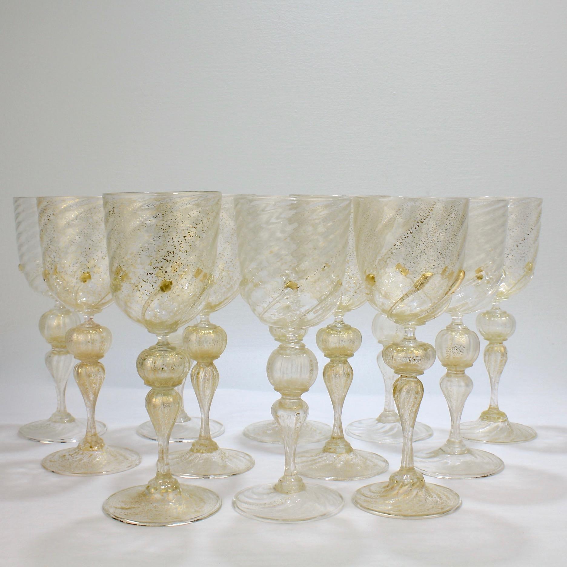 A vintage set of 12 large-sized Venetian glass water goblets or wine glasses.

Attributed to Salviati.

Finely blown with applied swirled prunts to the base of the cups and gold inclusions throughout.

Rare large-size goblets of the finest