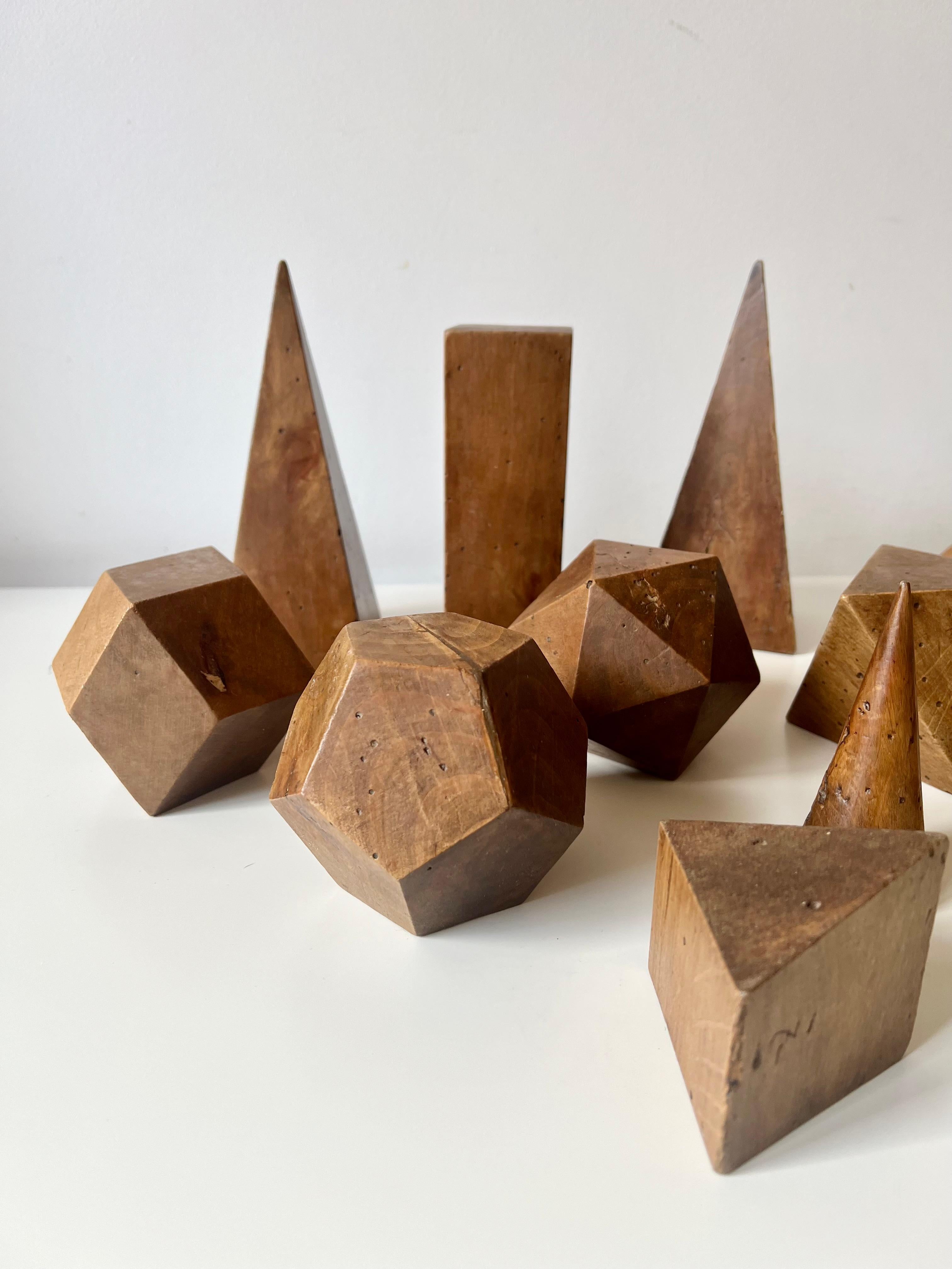 A 12 piece set of antique wooden geometric shapes, dating from the late 19th - early 20th century. Sourced from Italy,

This set of tactile wooden models was used either as an artist's resource or as a teaching aid for geometry and maths.

A great