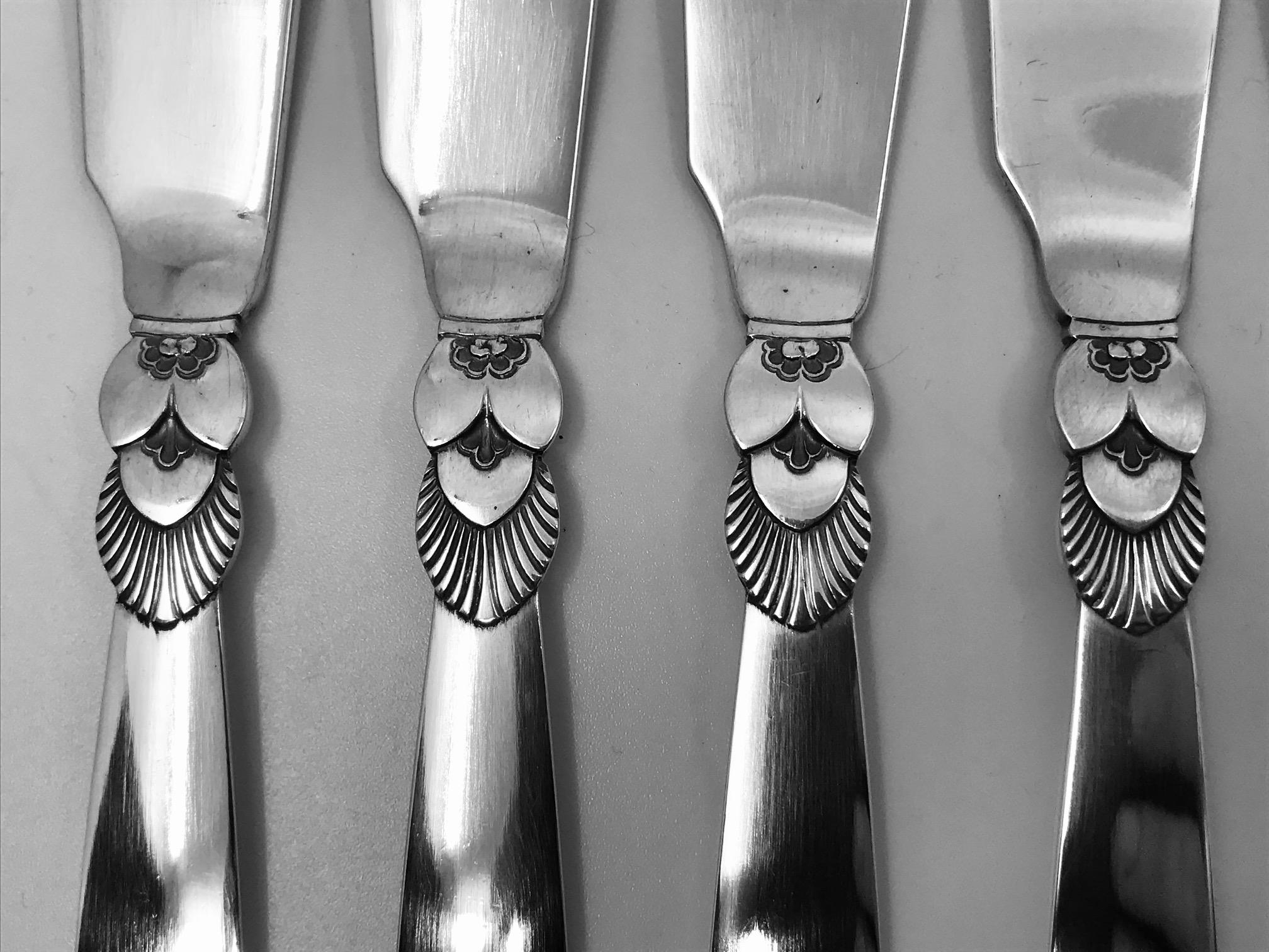 This is a set of 12 sterling silver Georg Jensen fish knives in the cactus pattern, design #30 by Gundorph Albertus from 1930.

Each measures 7 5/8? (19.4cm) in length.

All 12 marked with matching vintage Georg Jensen hallmarks from 1933-1944.