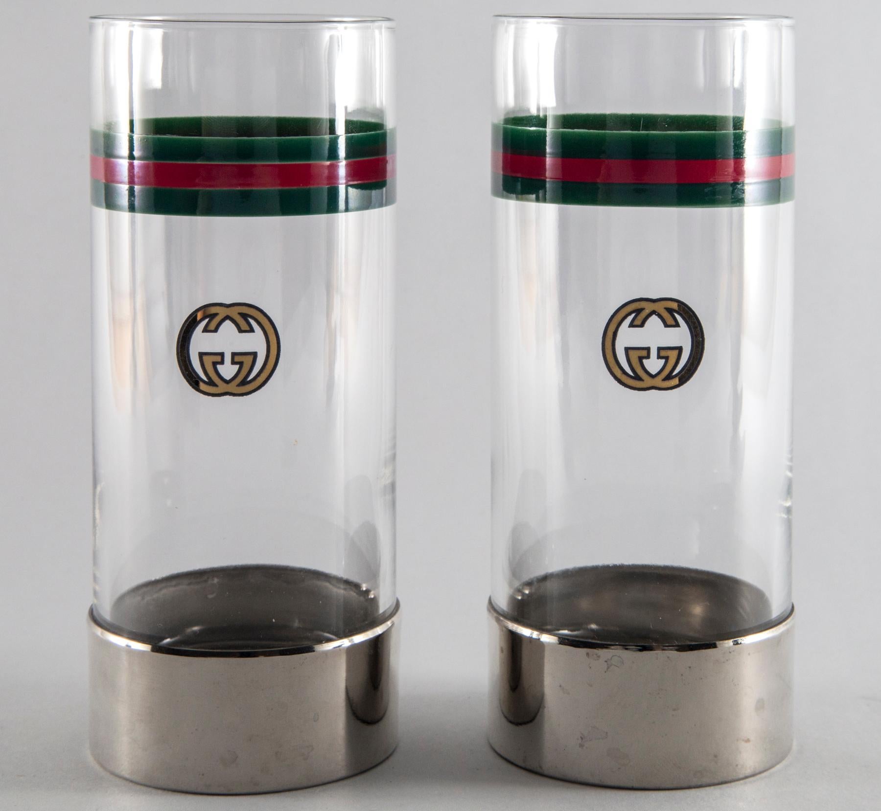Set of 12 Vintage Gucci highball glasses, circa 1970s from Italy. Glass and chrome base with iconic Gucci red and green stripe and logo. Tray is not available.