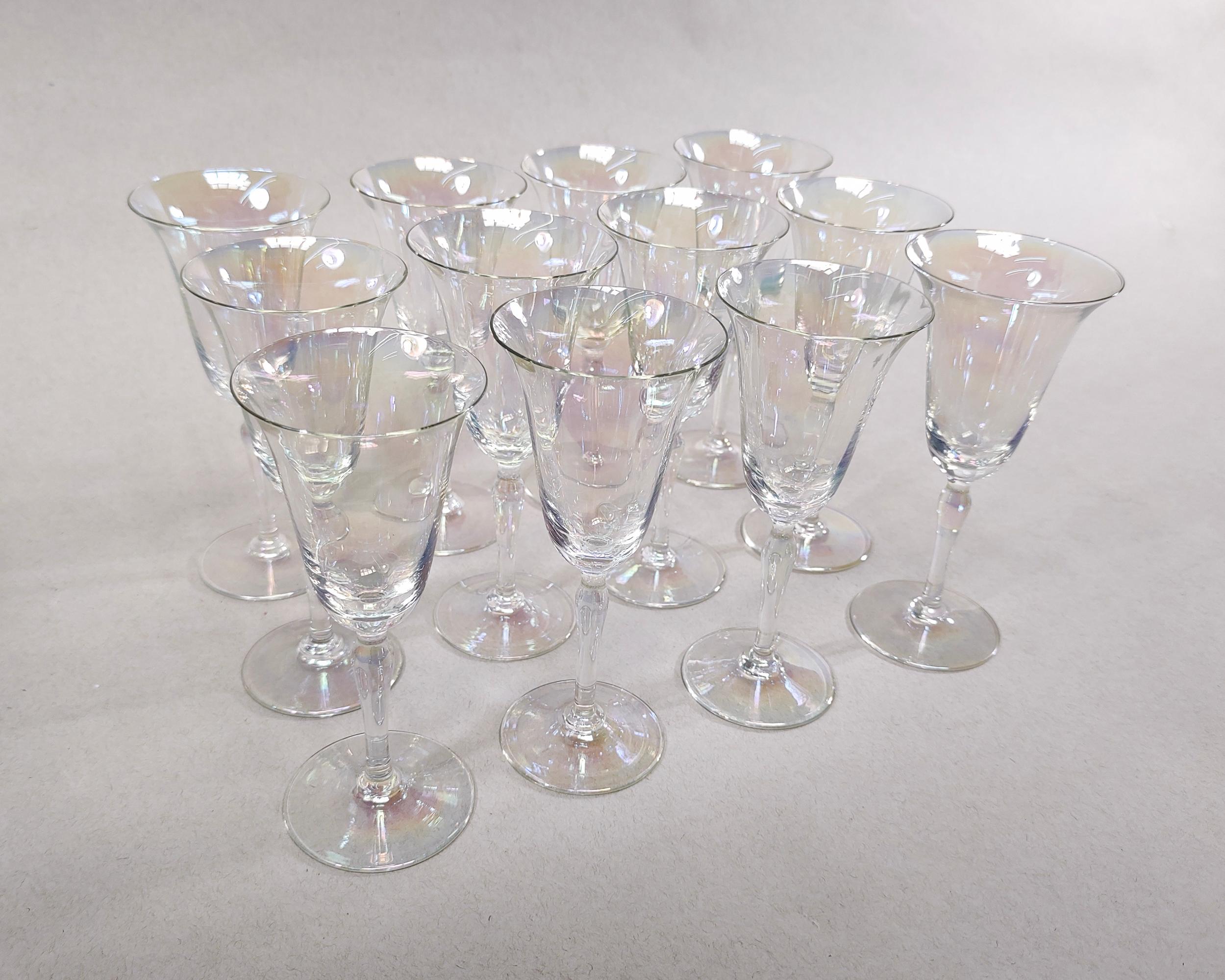 Set of 12 vintage 'Mother of Pearl' delicate iridescent tulip-shaped wine glasses by Fostoria circa 1930. Flared thin rims and hourglass shaped stems. Hand blown glass. Overall excellent condition. 

6.25