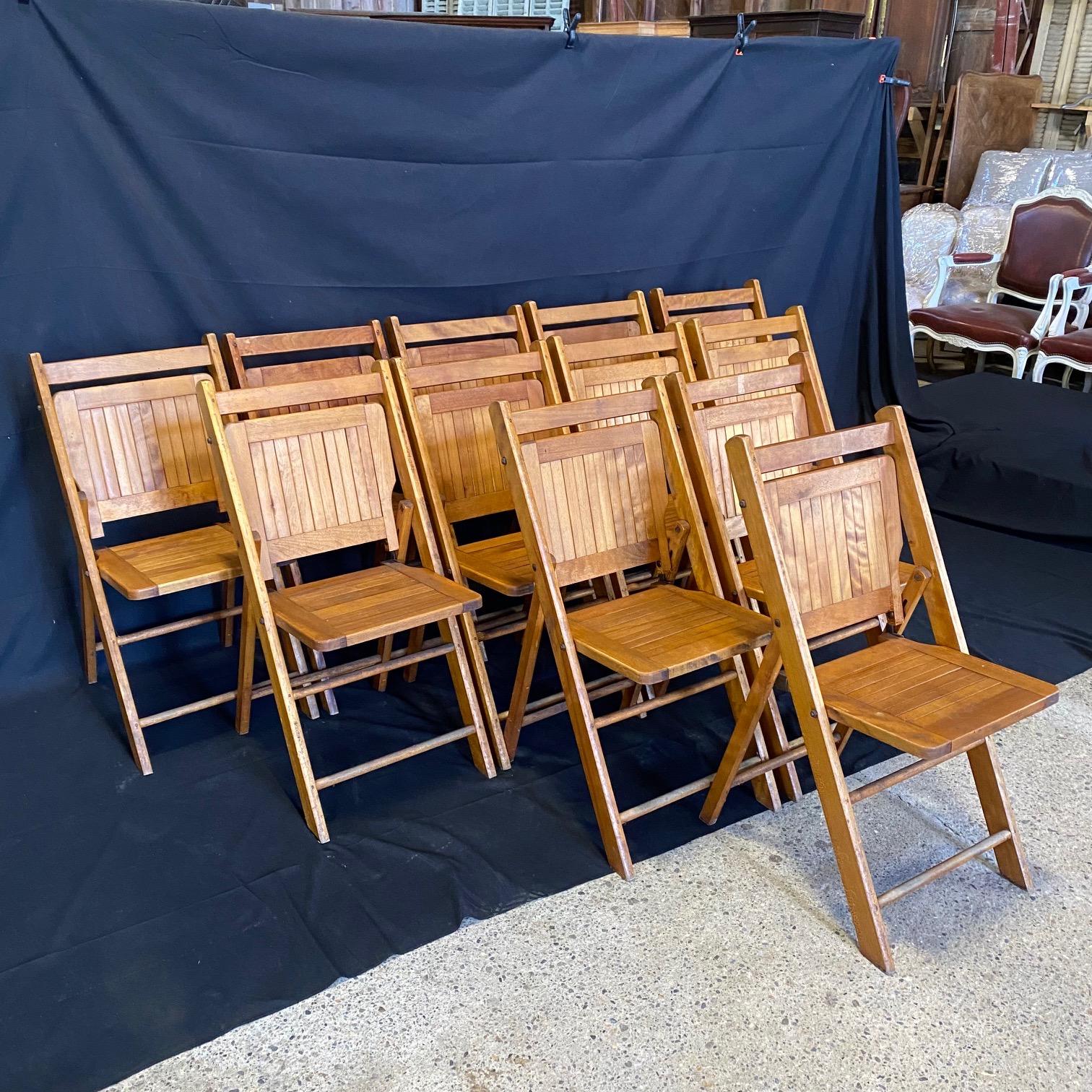 A set of very versatile vintage 1940s folding chairs in beech with brass details and marked Paris on the backs.   Paris Manufacturing Co., Maine
#2810