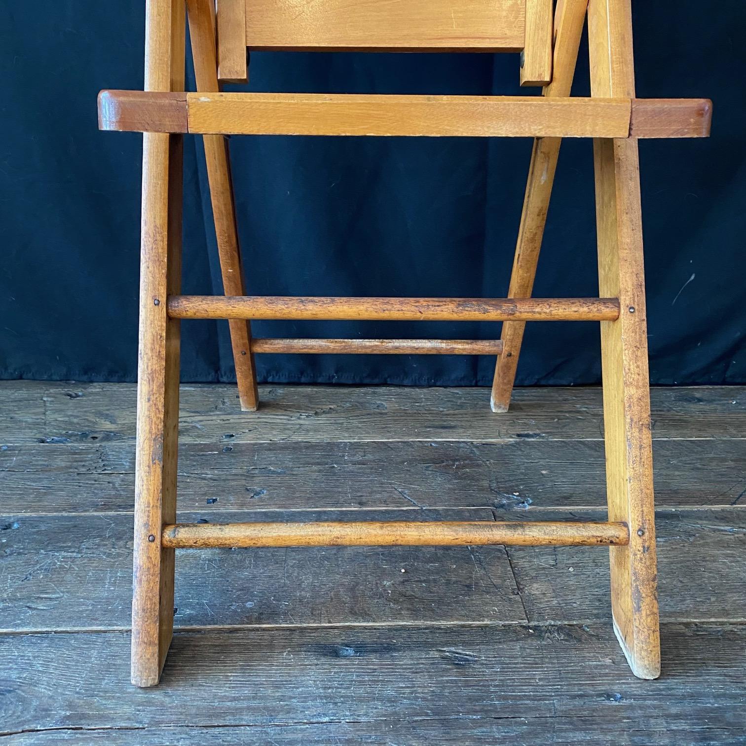 Vintage 1940s folding chairs in beech with brass details. A really great midcentury set! Marked Paris Maine.
NOTE: We will sell these as pairs, fours, etc. Have multiples and bought the whole lot.
Measures : Folded: H 36.75