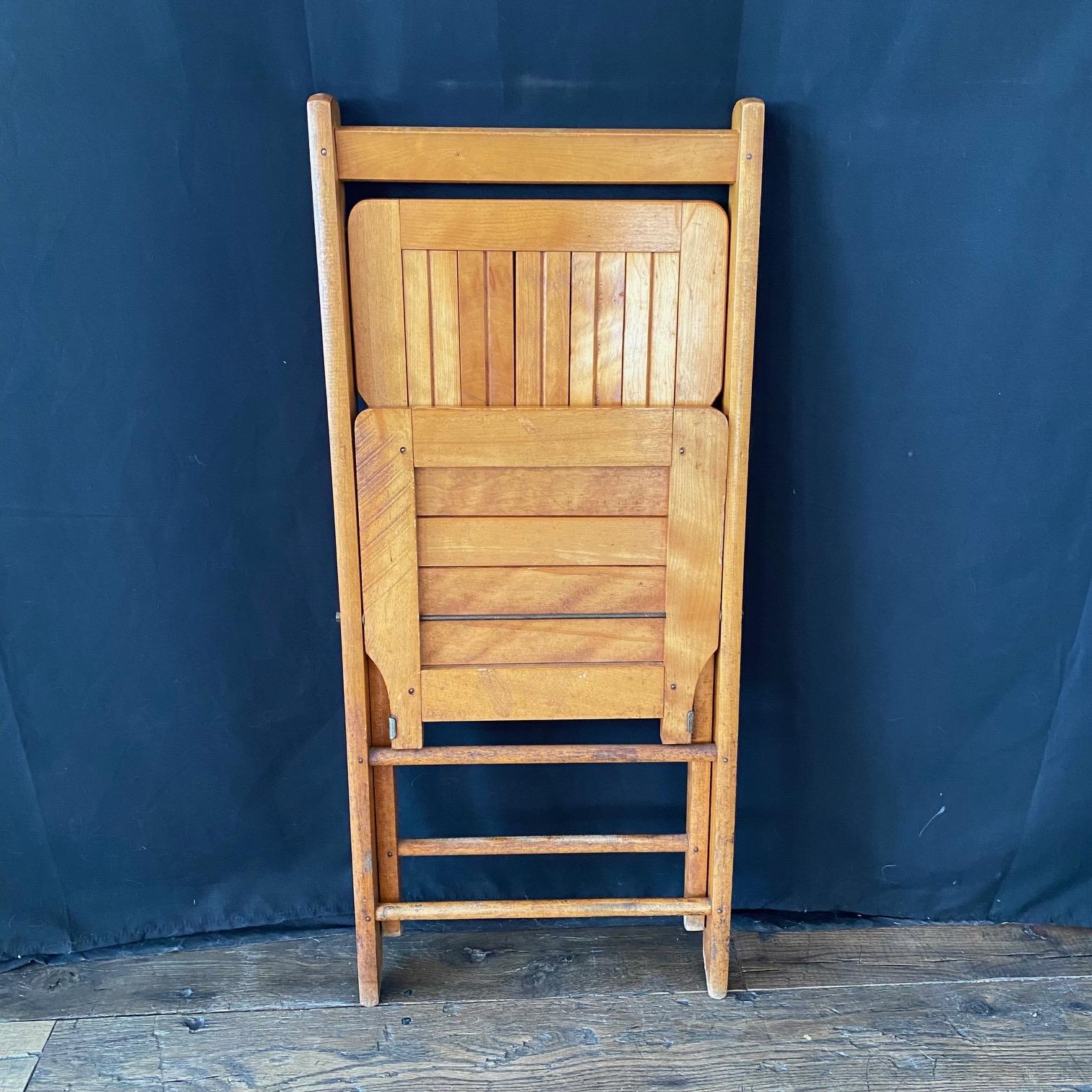 Mid-20th Century Set of 12 Vintage Wooden Stackable Folding Chairs Marked Paris For Sale