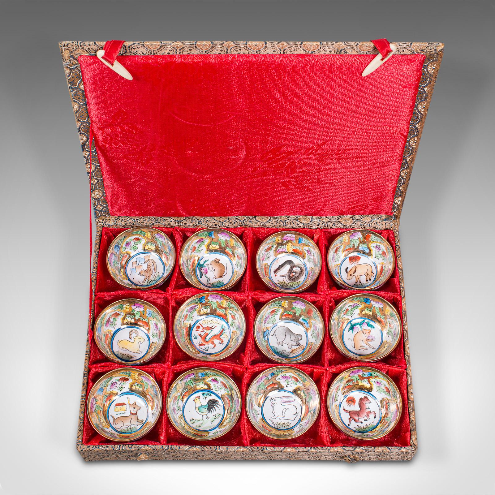 This is a set of vintage zodiac cups. A Chinese, ceramic miniature dish displaying the lunar calendar of animal signs, dating to the mid 20th century, circa 1950.

A charming kung fu or zisha tea cup set, presented in a distinctive case
Displays