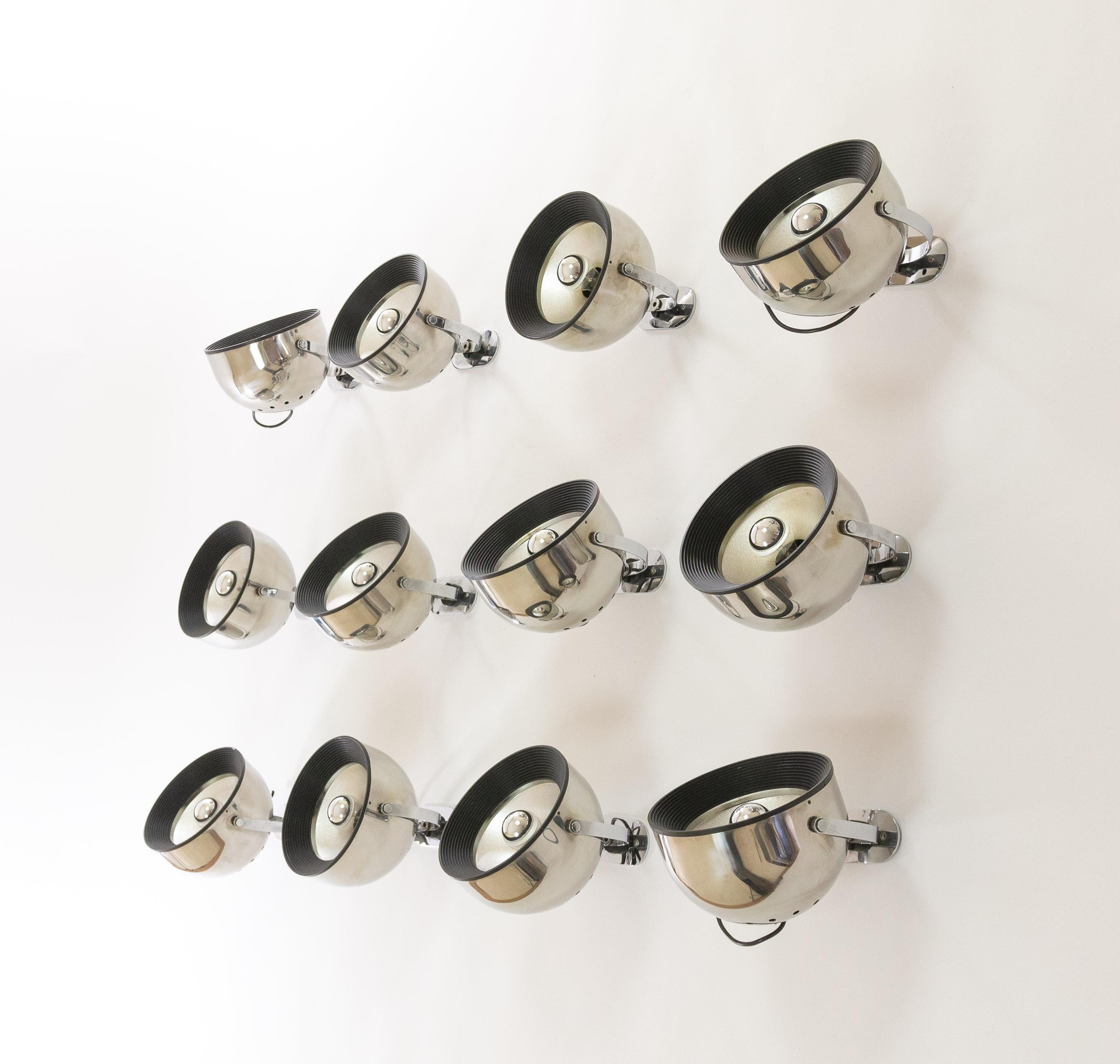 Set of 12 swiveling wall spots of chromed metal designed by Gae Aulenti and Livio Castiglioni for Stilnovo, 1970s.

As described in a catalogue by Stilnovo these lamps by Gae Aulenti and Livio Castiglioni have been designed in various versions: