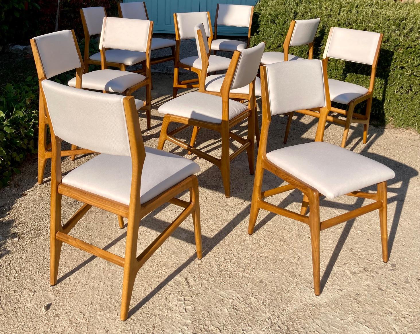 A set of 12 Gio Ponti wallnut dining chairs.
Designed by Gio Ponti.
Manufactured by Figli di Amedeo Cassina 
Model 687, design 1953.
 Lit: Domus, n. 312, nov 1955
The wood of the chairs has been cleaned and refinished. the chairs have been