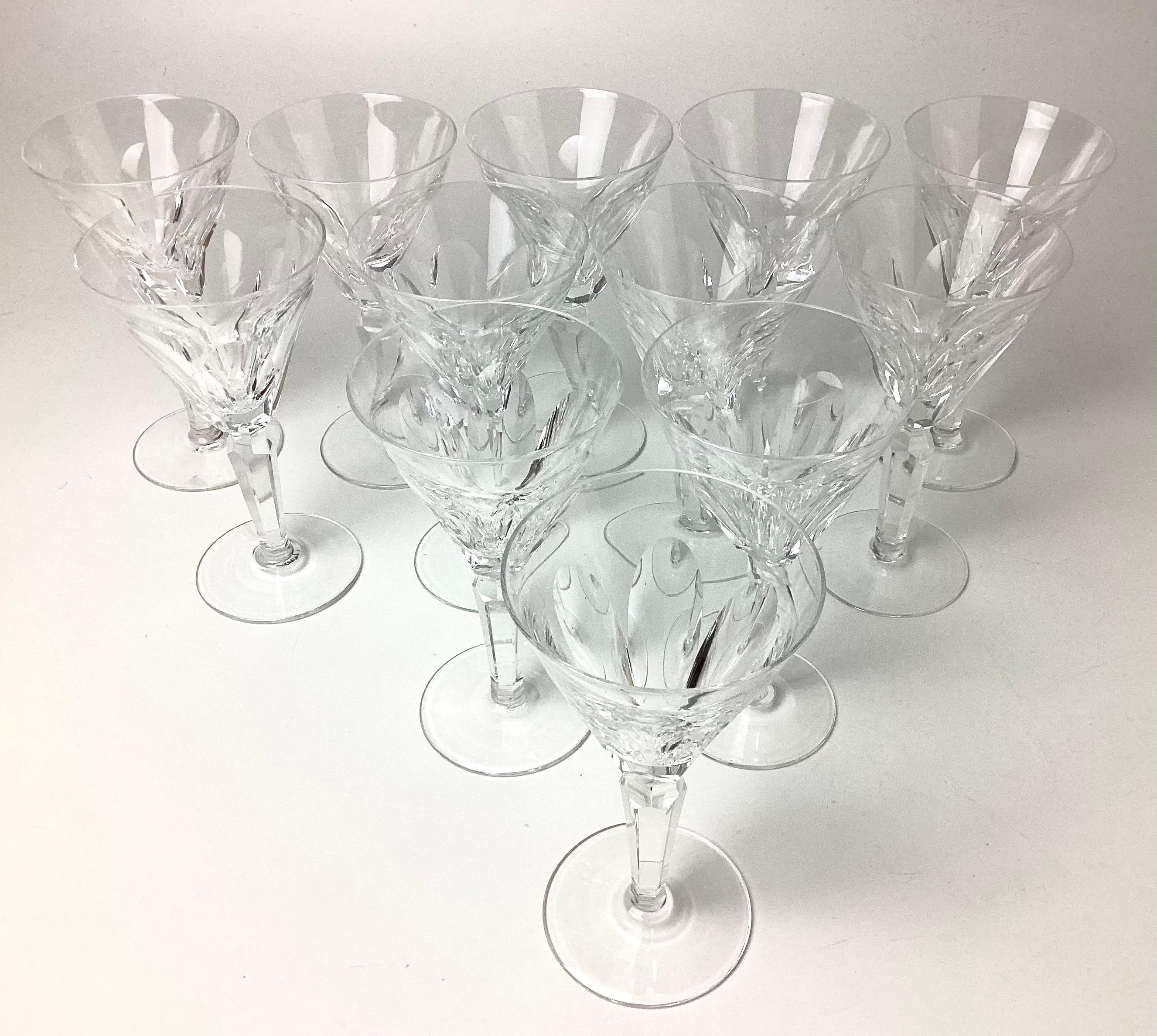 Set of 12 Waterford Sheila Cut wine glasses. This pattern has been discontinued. Made from 1958 - 2017. 6 cut panels with a multisided stem. Marked with the Waterford mark on the bottoms.