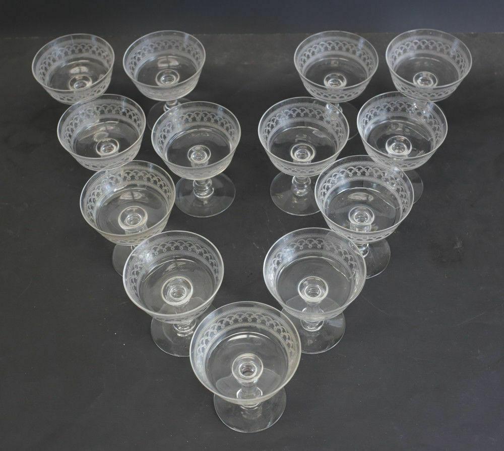 Set of 13 Continental Artisan glass & etched acid Sherbet Compotes, c.1940

Aid engraved swirls up to the top edge of the glasses.

Additional Information:
Features: Etched 
Material: Crystal
Glassmaking Technique: Etched 
Type of Glass:
