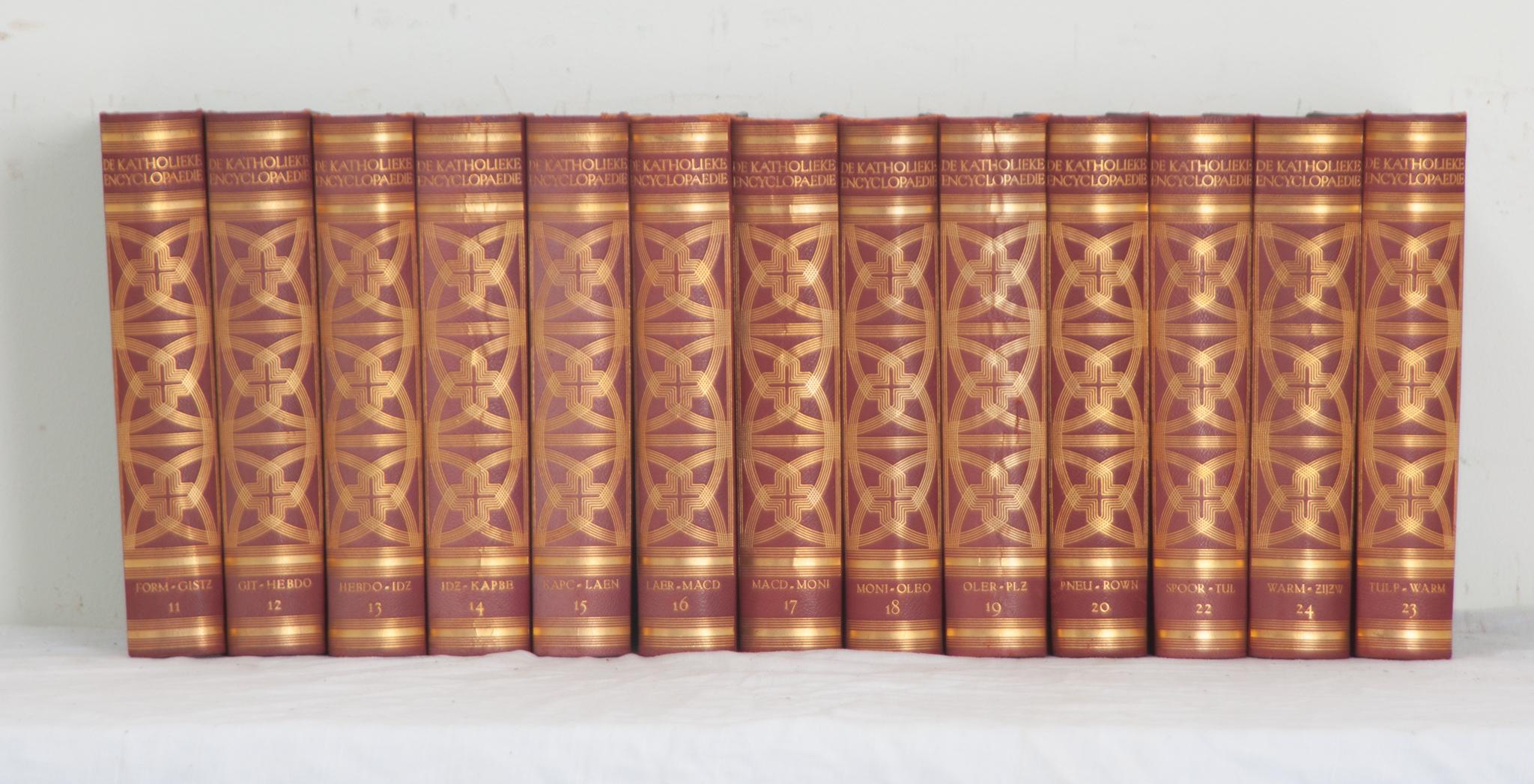 A collection of thirteen volumes of a Catholic encyclopedia by Dutch author N. V. Uitgeversmij. This set is leather bound with gold tooling stamped with the title and respective volume. Written in 1935-1938, the set details catholic theology. There