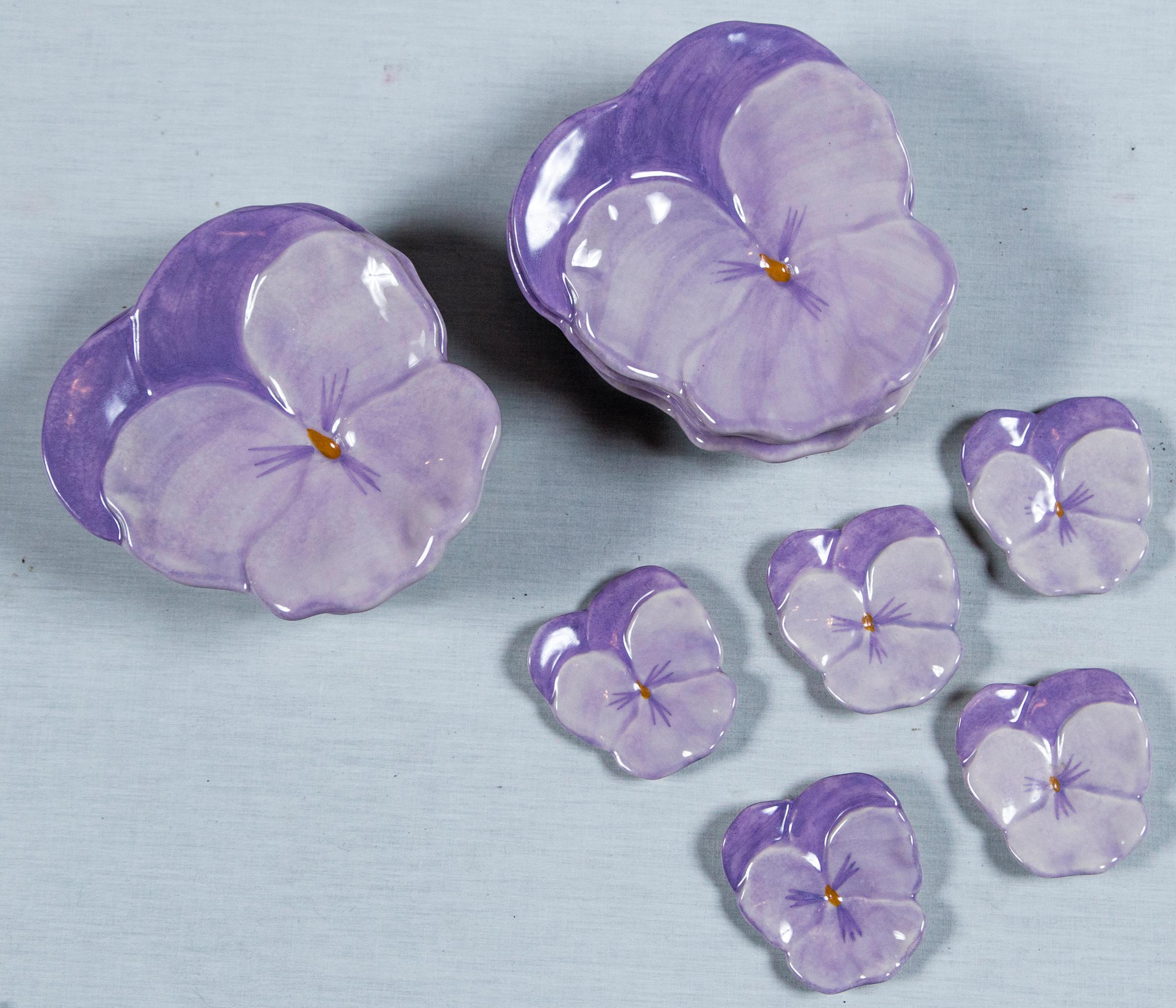 Midcentury highly collectible ceramics. Eight medium size purple pansy plates by Ernestine Salerno Italian ceramic dishes. Five small size purple pansy by same. Small plates are 3.25 by 3.5 inches.