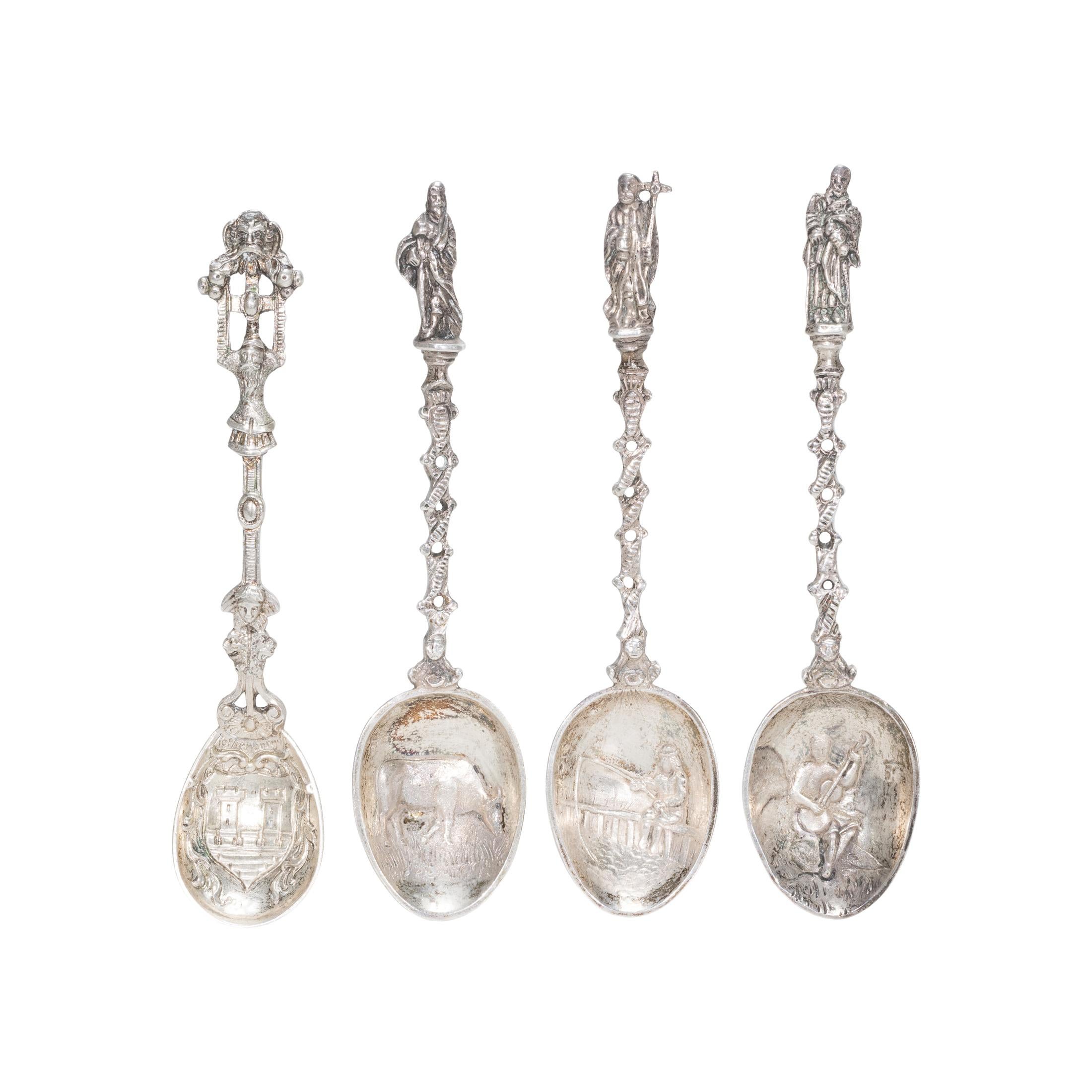 Set of 13 German 800 apostle spoons. One with Virgin Mary and baby. 17th to late 19th Century. An apostle spoon is a spoon with an image of an apostle or other saint as the termination of the handle, each bearing his distinctive emblem. Apostle