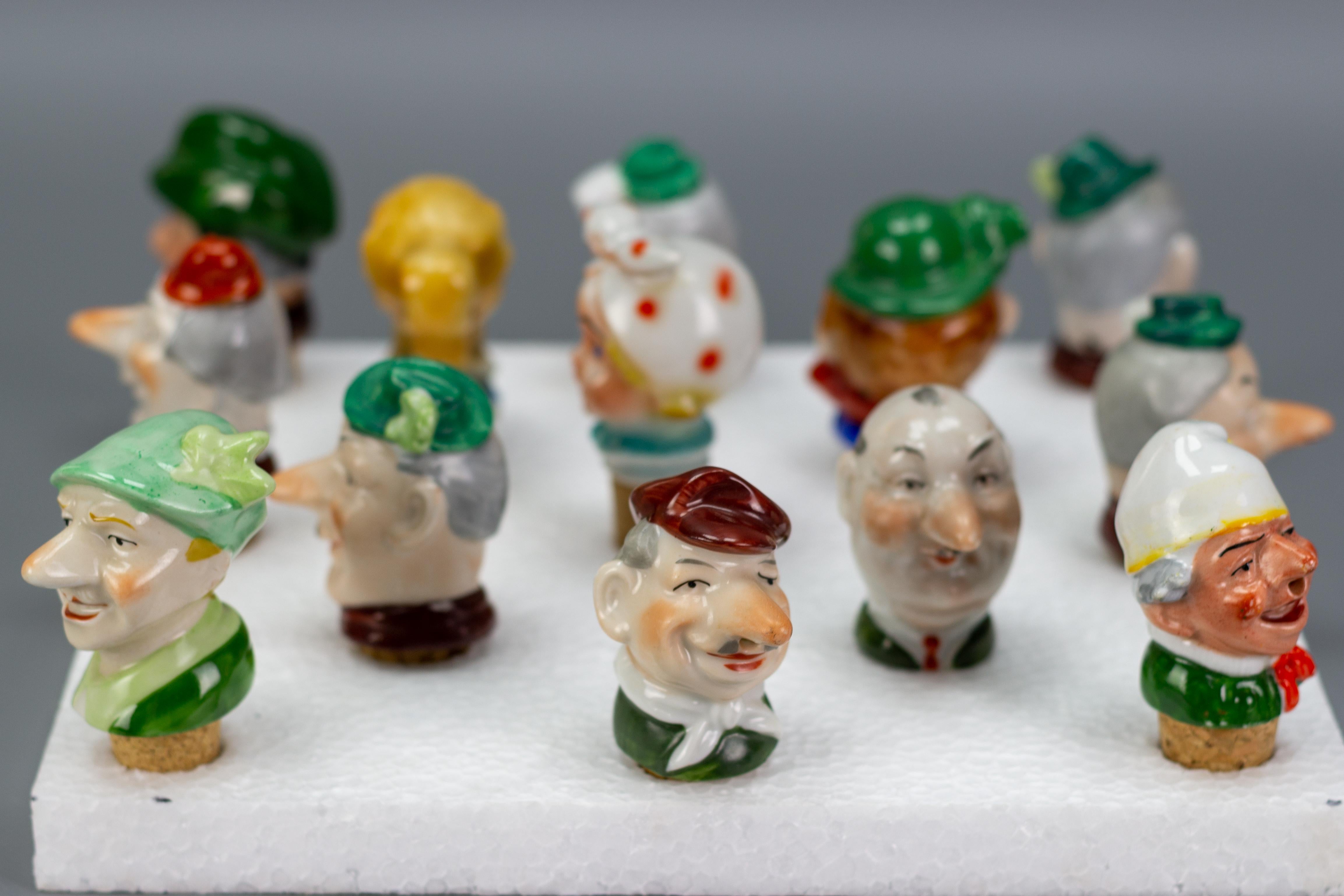 Art Deco Set of 13 German Figural Porcelain and Cork Pourers Bottle Stoppers, 1930s For Sale