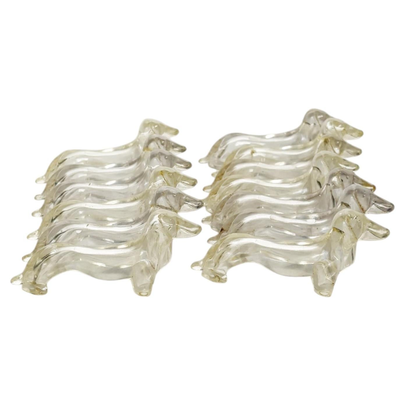 Set of 13 Plastic knife rests dog shaped, France, 1970