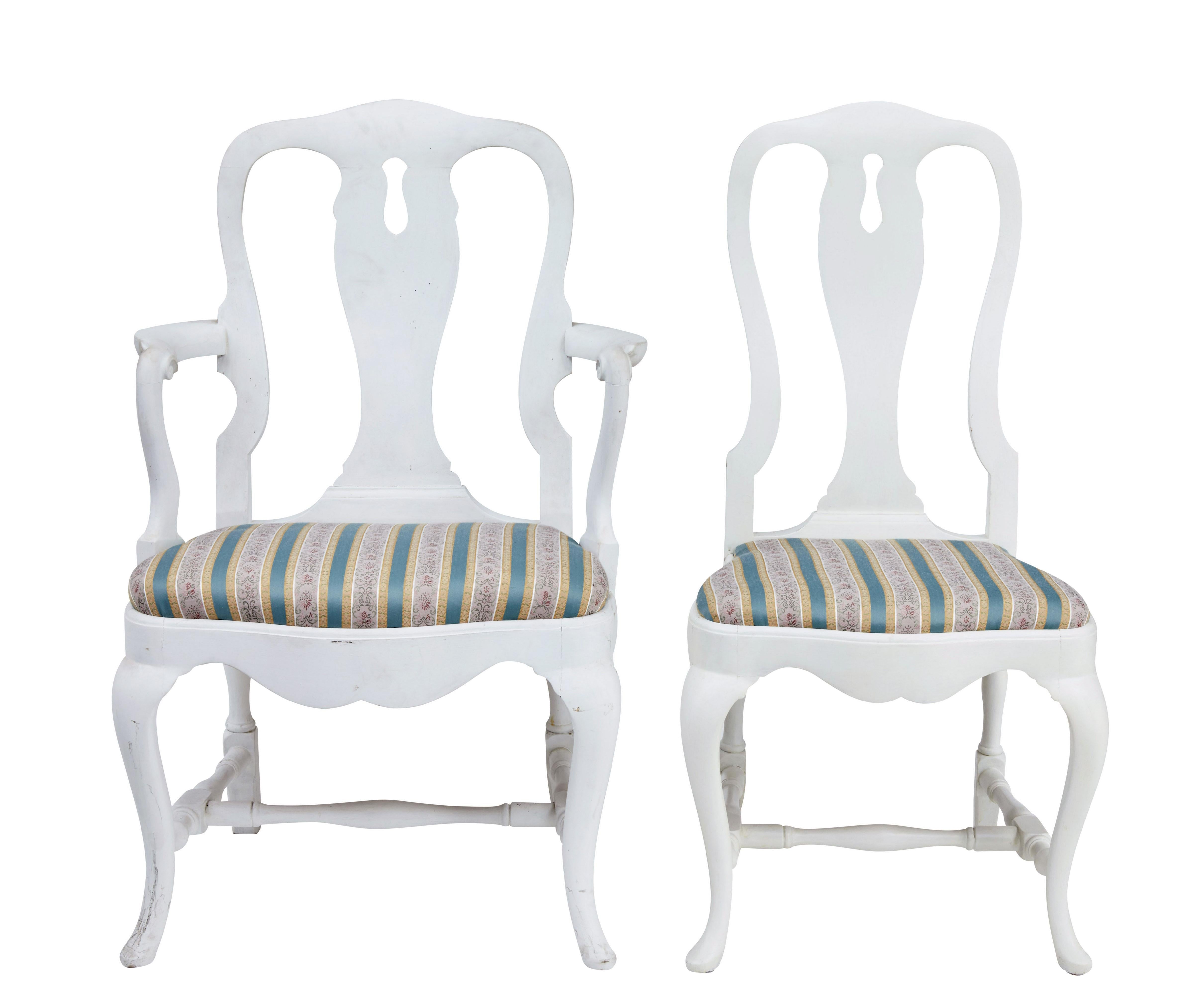 Set of 14 1920's Queen Anne design dining chairs circa 1920.

Set comprises of 12 single chairs and 2 carver armchairs.  Made in beech and later painted white.

Shaped Queen Anne design backs, with drop in seats which are in good usable