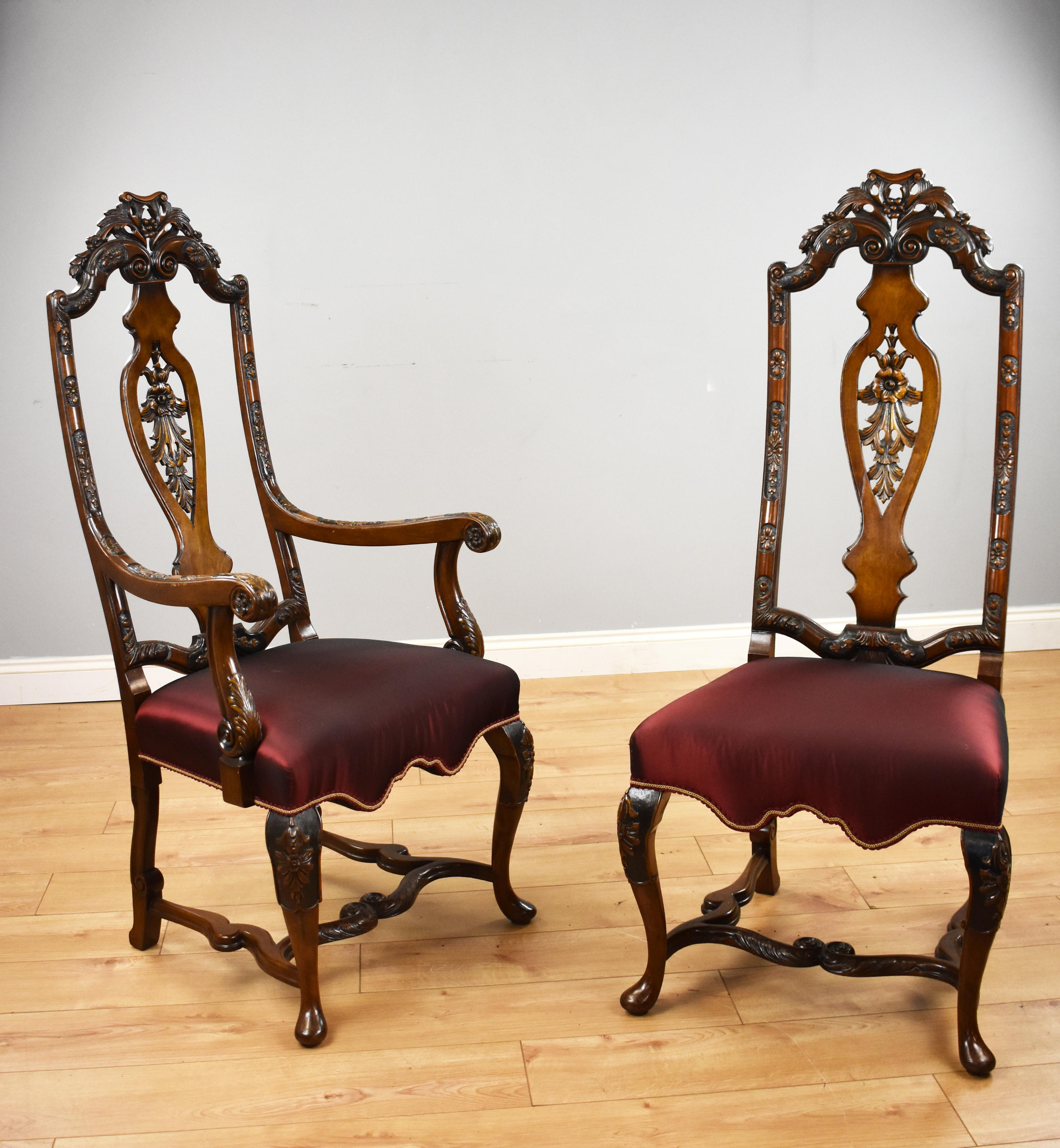 For sale is a good quality set of 14 Queen Anne style dining chairs, each having high backs with carving to the top, standing on elegantly carved cabriole legs united by an ornately shaped and carved stretcher. Each chair is in good condition,