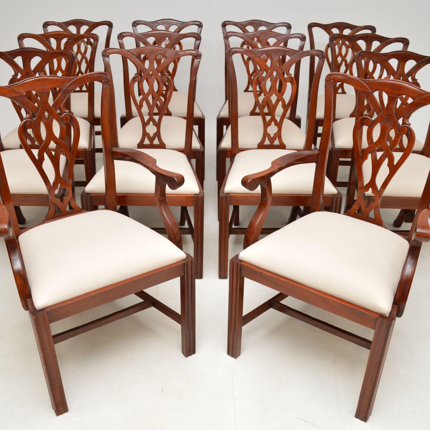 A grand set of fourteen antique dining chairs in the Chippendale style. They were made in England, and they date from around the 1950’s.

The quality is fantastic, they are all beautifully constructed with beautiful pierced lattice backs. They sit