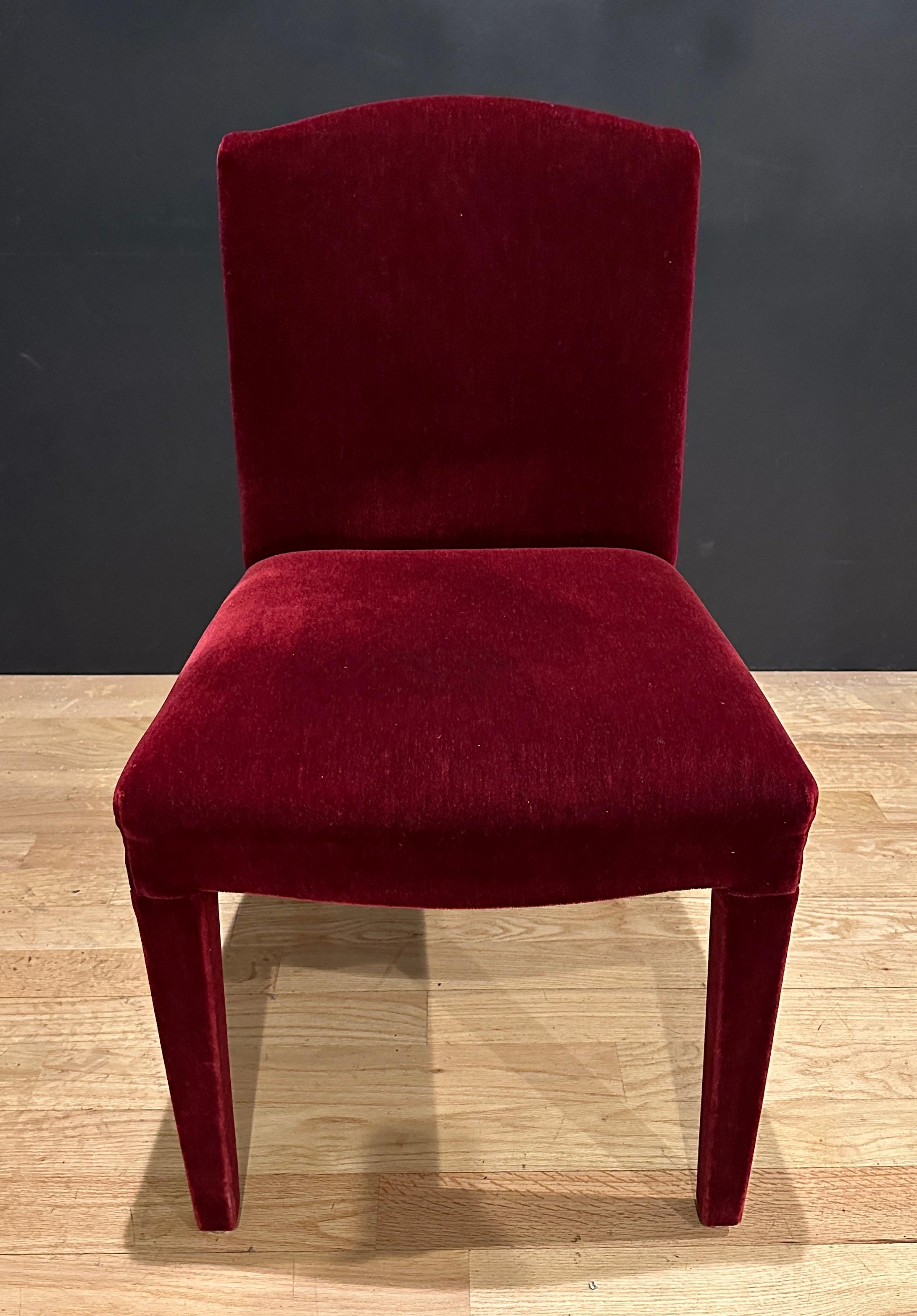 14 custom and finely upholstered , simple and tailored burgundy color mohair dining room chairs. Comfortable and beautiful.