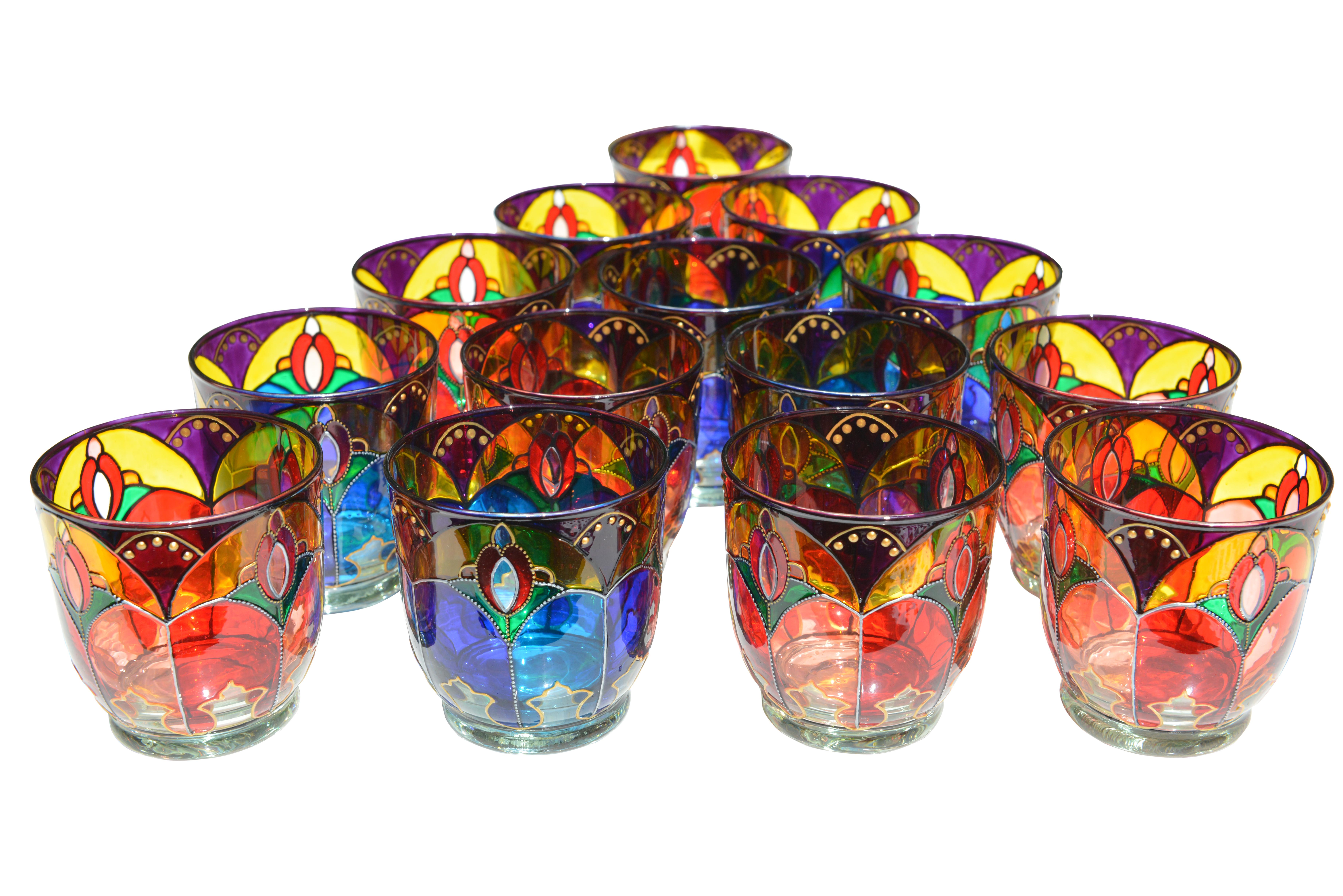 Striking set of 14 multi-color hand printed crystal glasses from Ibiza. Decorating crystal with hand painting in a centuries-old tradition in Spain. They are made by crystal painter specialists.