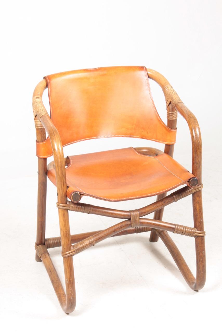 Set of 14 side chairs in bamboo and leather. Designed and made in Denmark in the 1960s.
