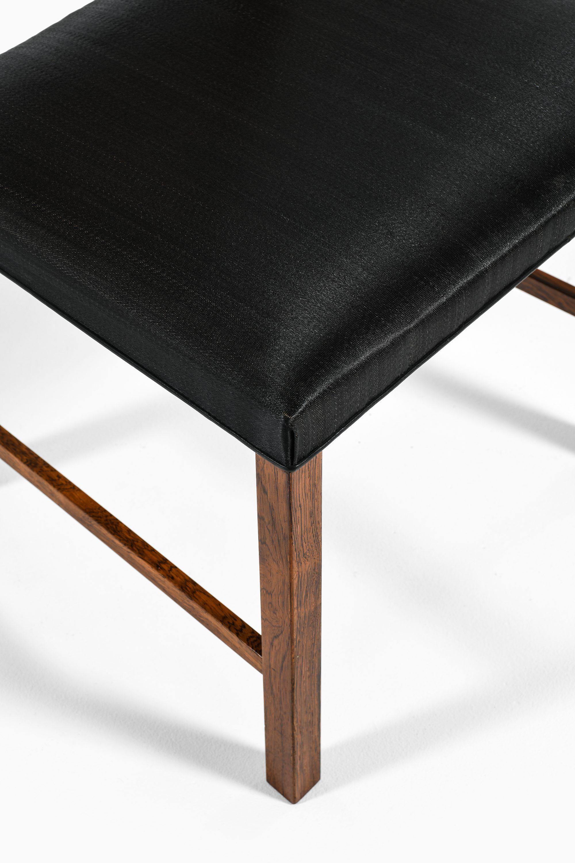 Set of 14 Dining Chairs in Rosewood and Cane by Bernt Petersen, 1960's For Sale 4