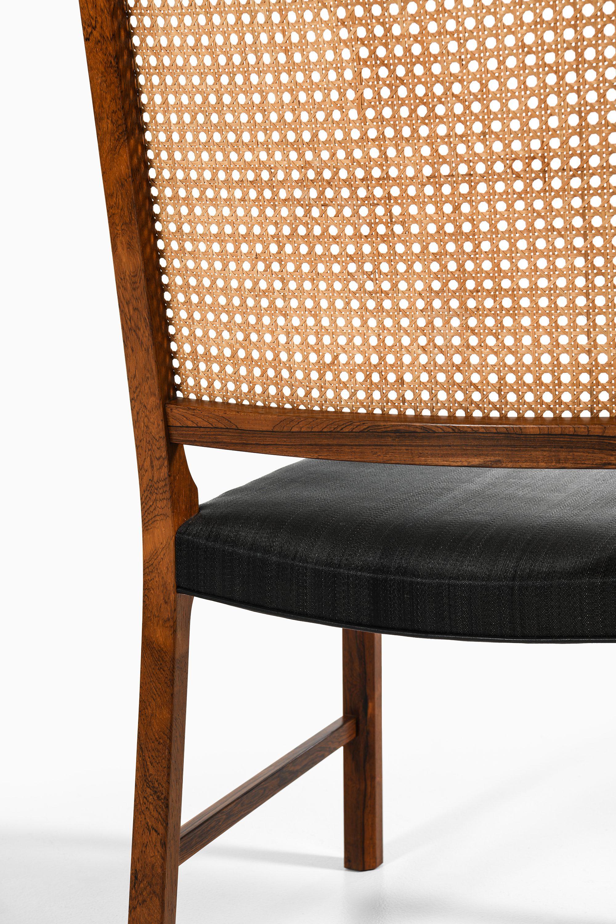 Set of 14 Dining Chairs in Rosewood and Cane by Bernt Petersen, 1960's For Sale 5